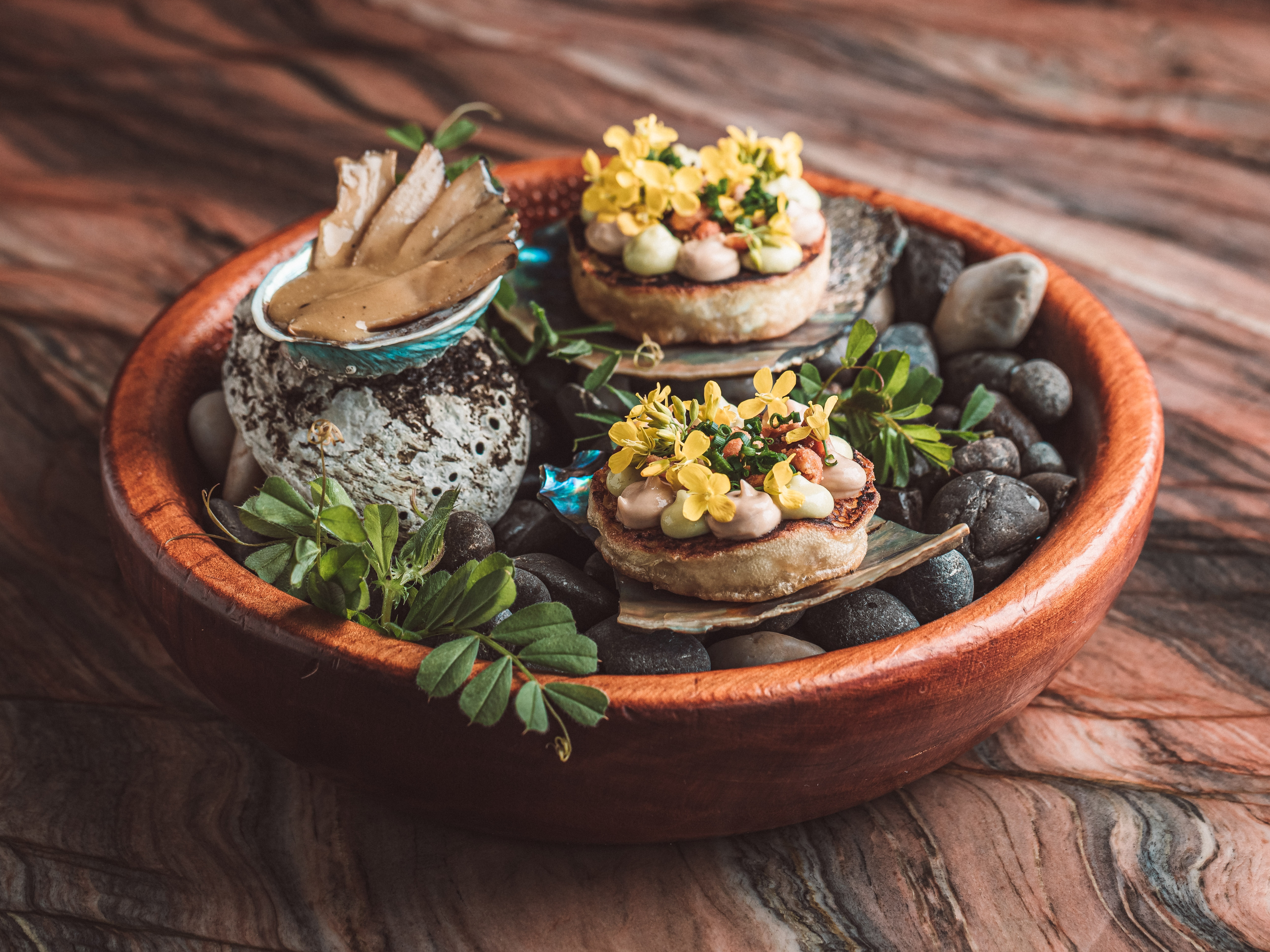 Ahi's Queen pāua crumpet with fermented peanut butter, smoked dulse and celery leaf mayonnaise. Photo / Tez Mercer