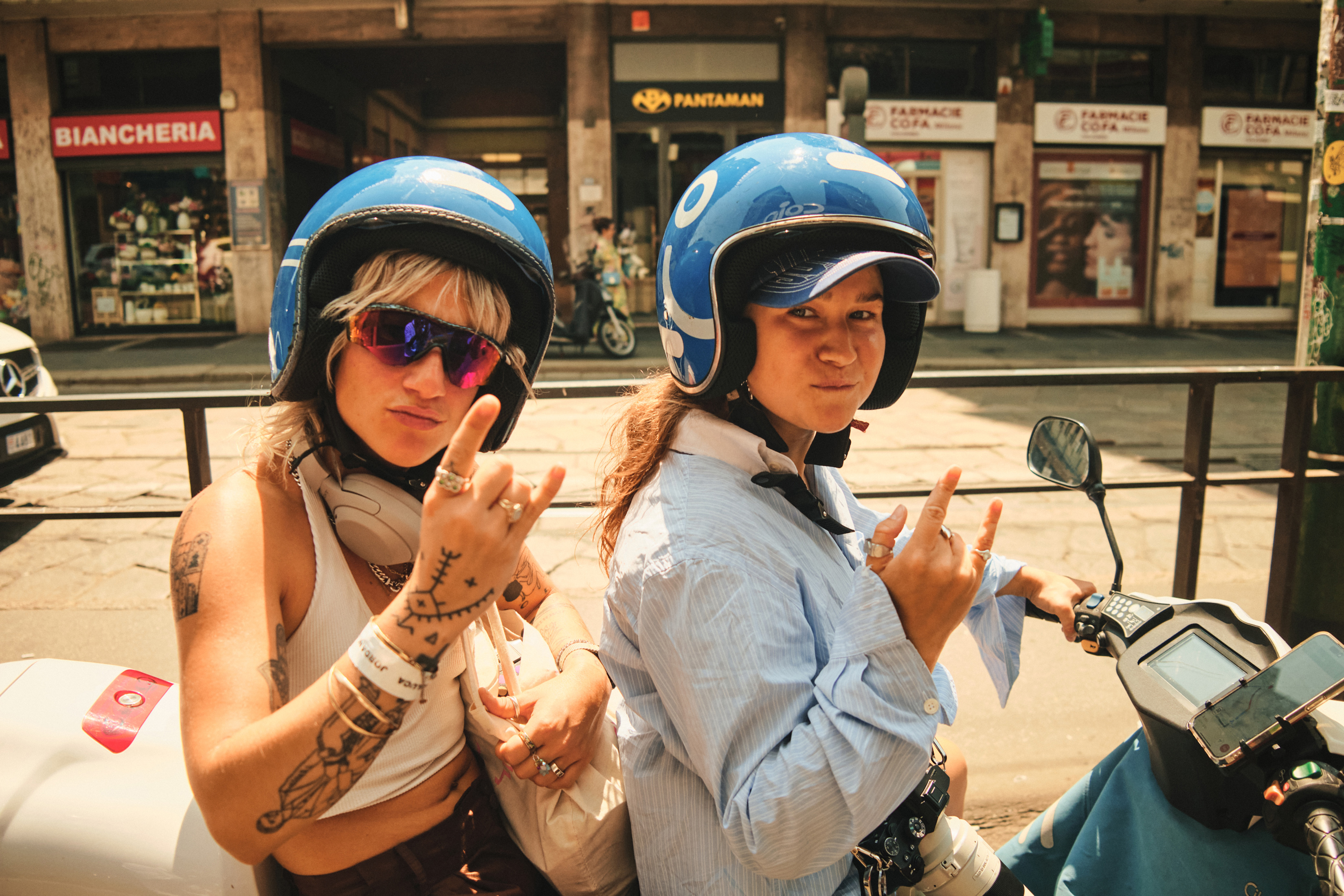 Photographers Christina Fragkou, left, and Eseniya Araslanova in between shows, in Milan. Photo / Simbarashe Cha, The New York Times