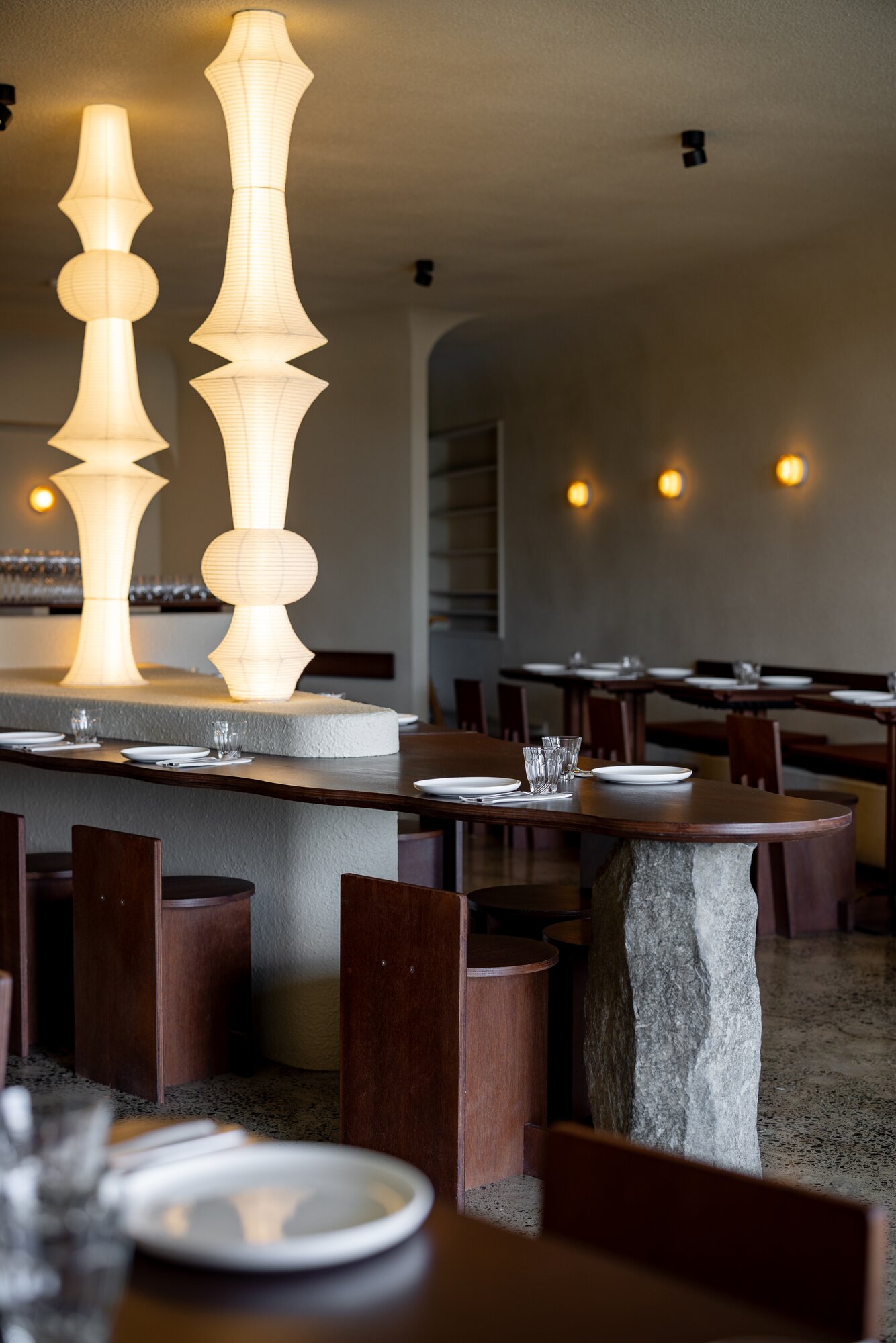 The sleek fit-out of Olle in Milford with glowing lanterns and dark wooden furniture. Photo / Babiche Martens
