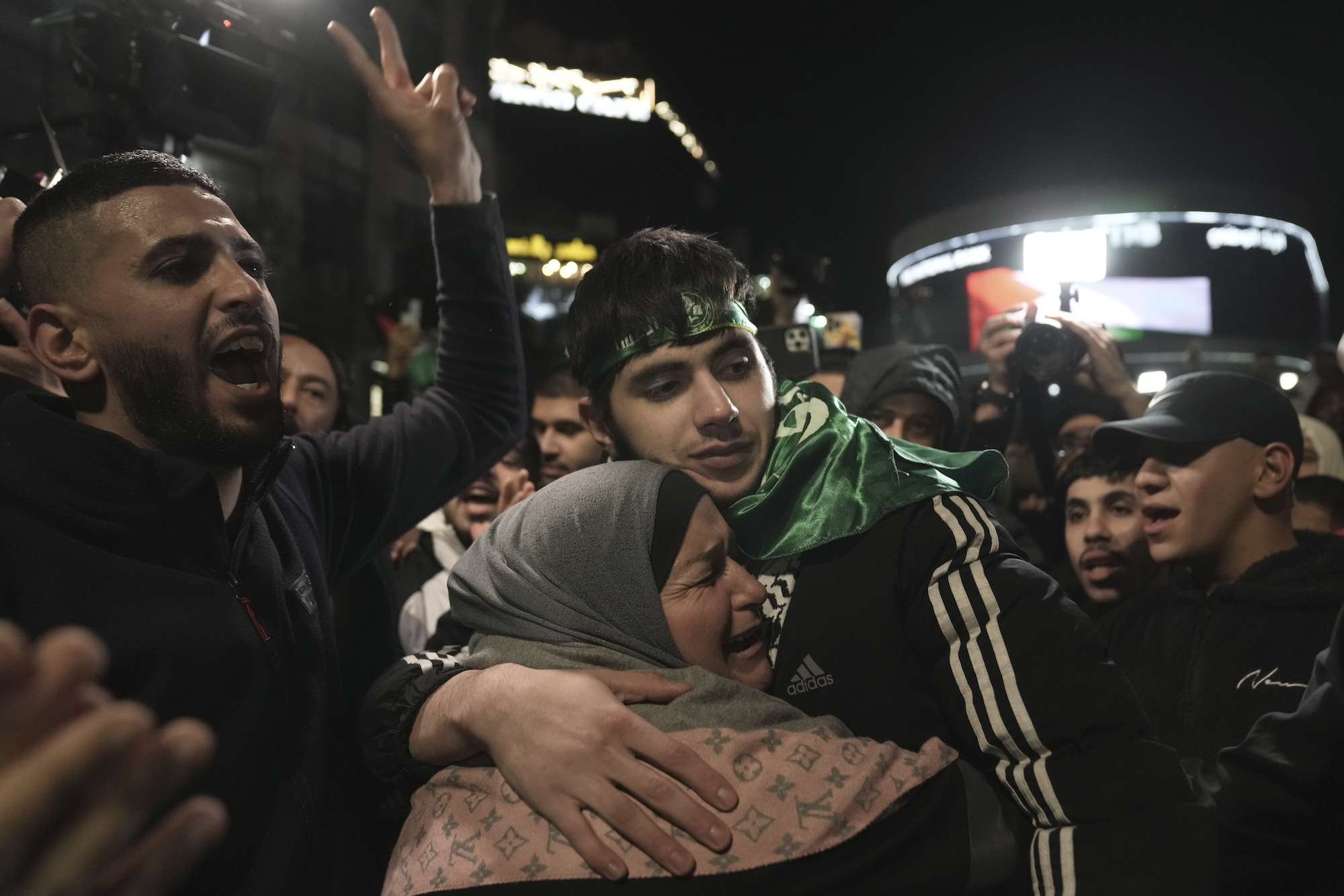 Omar Atshan, 17, is hugged by his mother after being released from an Israeli prison in the West Bank town of Ramallah. Photo / AP