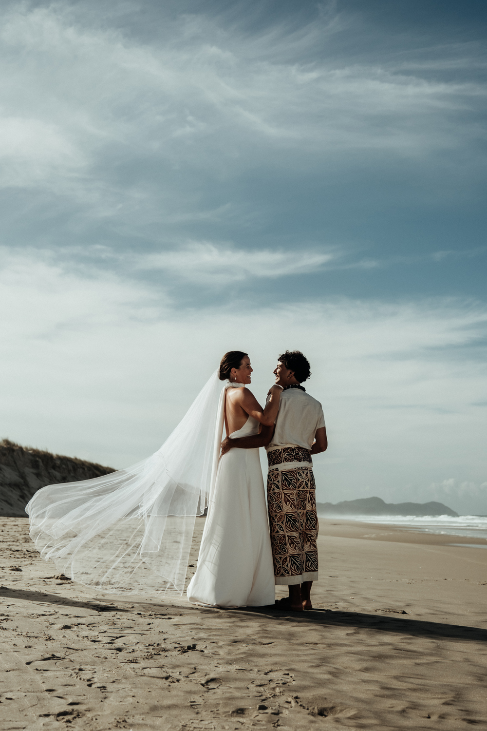 Hayley and Connor Felise chose a beach in Te Arai for their nuptials. Photo / Geoffery Matautia and Hele Ikimotu