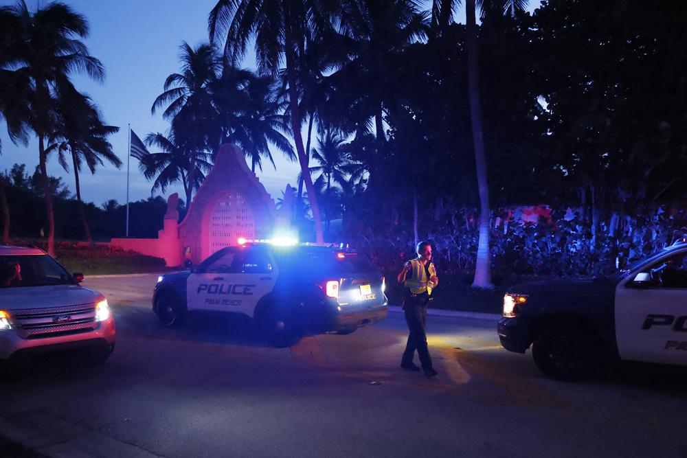 Police direct traffic outside an entrance to former President Donald Trump's Mar-a-Lago estate, August 2022. Photo / AP