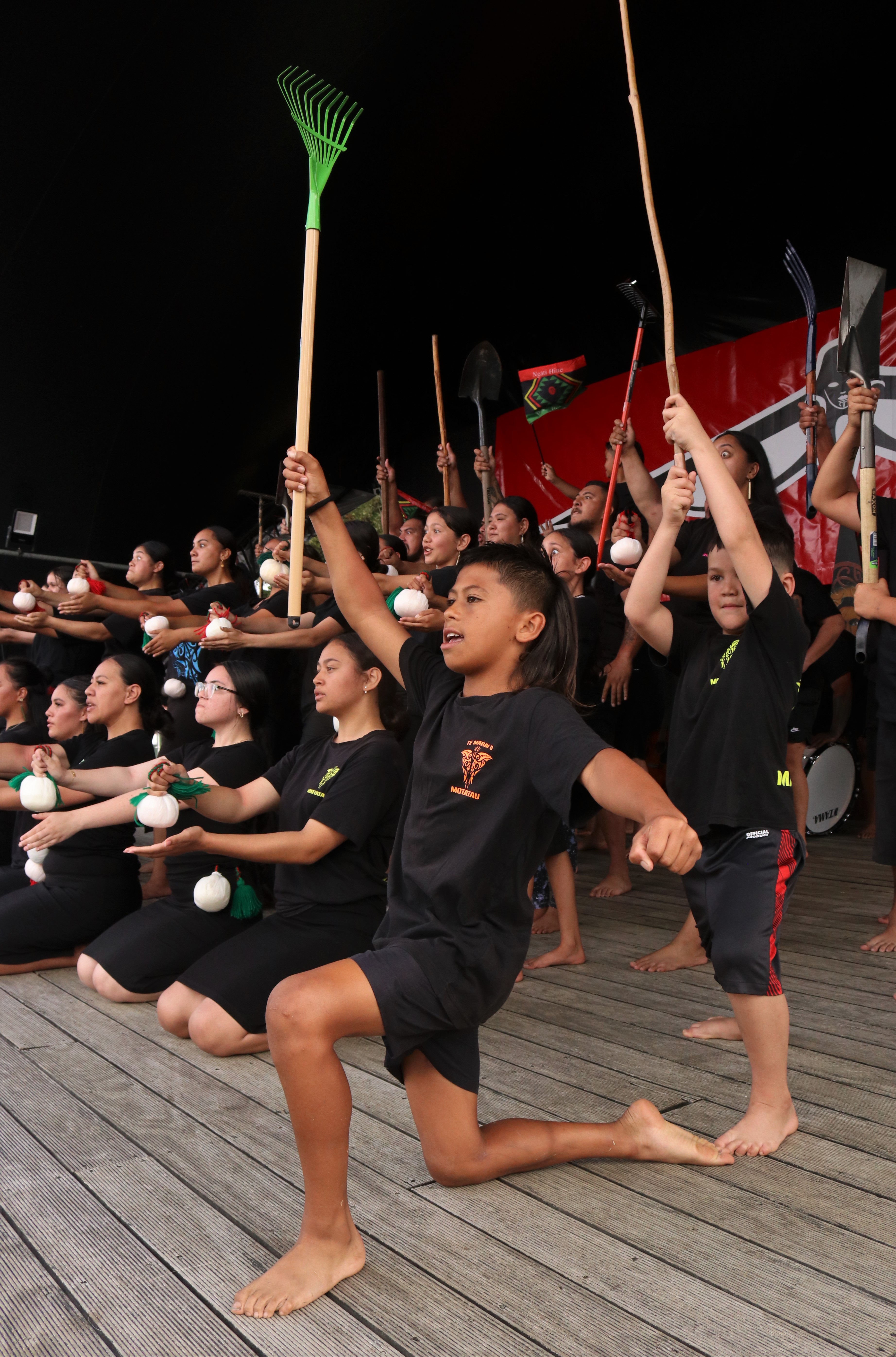 Awatea Tipene, 11, holds a rake in a Motatau Marae performance paying tribute to the famed gardening skills of Ngāti Hine ancestor Hineamaru. Photo / Peter de Graaf