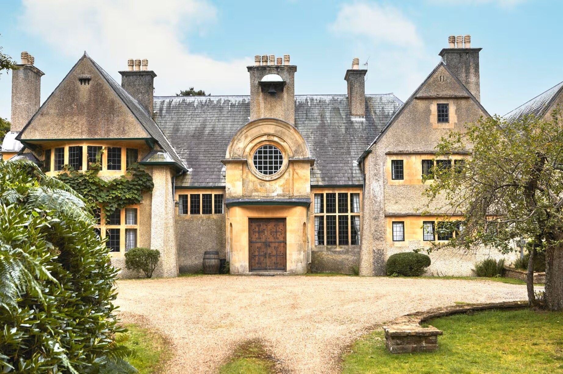  Norney Grange, the historic home in Surrey, UK, which featured in the movie The Dig. It is owned by businessman and philanthropist Andrew Barnes and his partner Charlotte Lockhart.