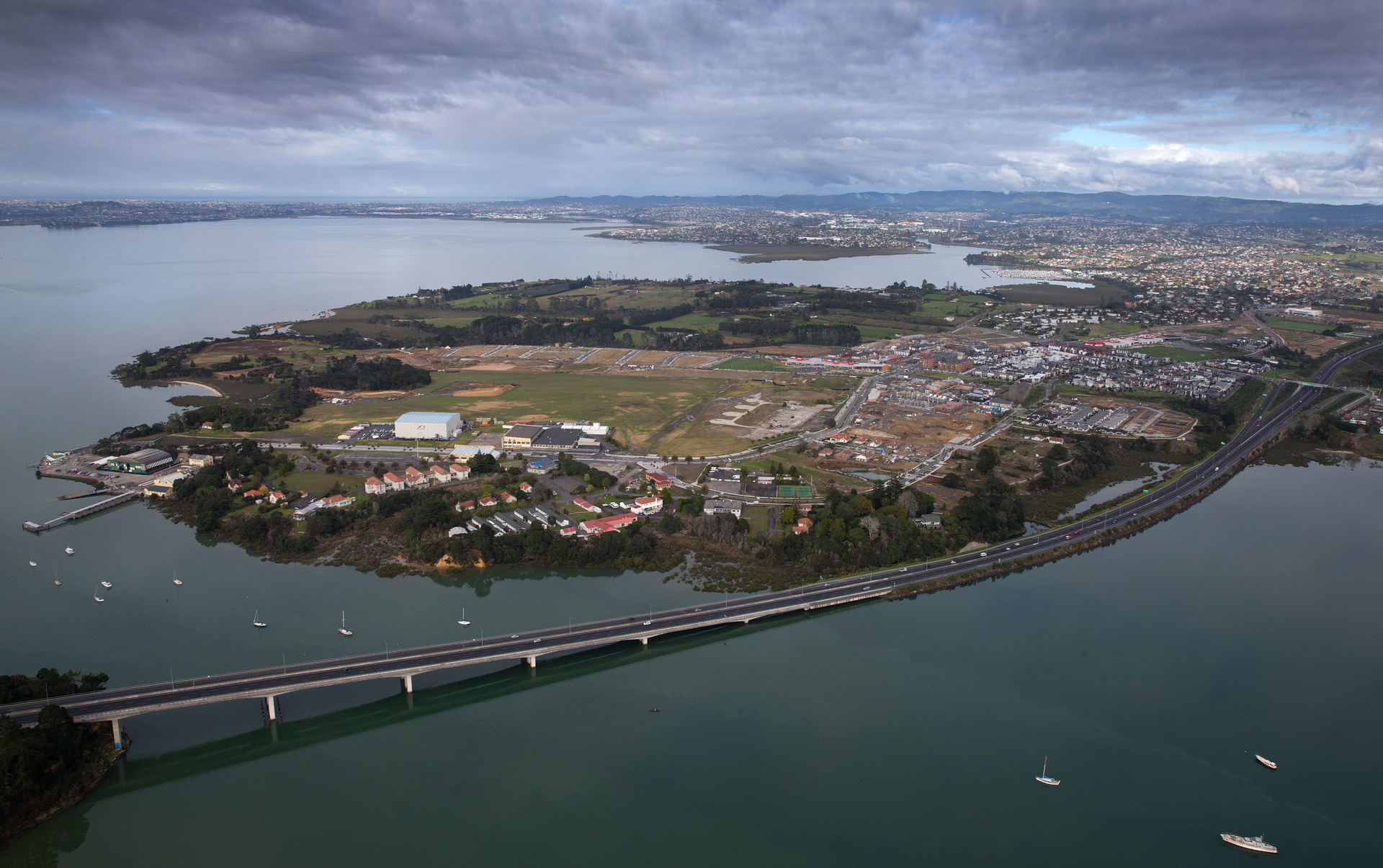 The Upper Harbour Bridge with Hobsonville Point behind it. Photo / Brett Phibbs