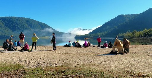 The remnants of the fog lift as the Monday Walkers enjoy a coffee stop with a view over Lake Tikitapu.