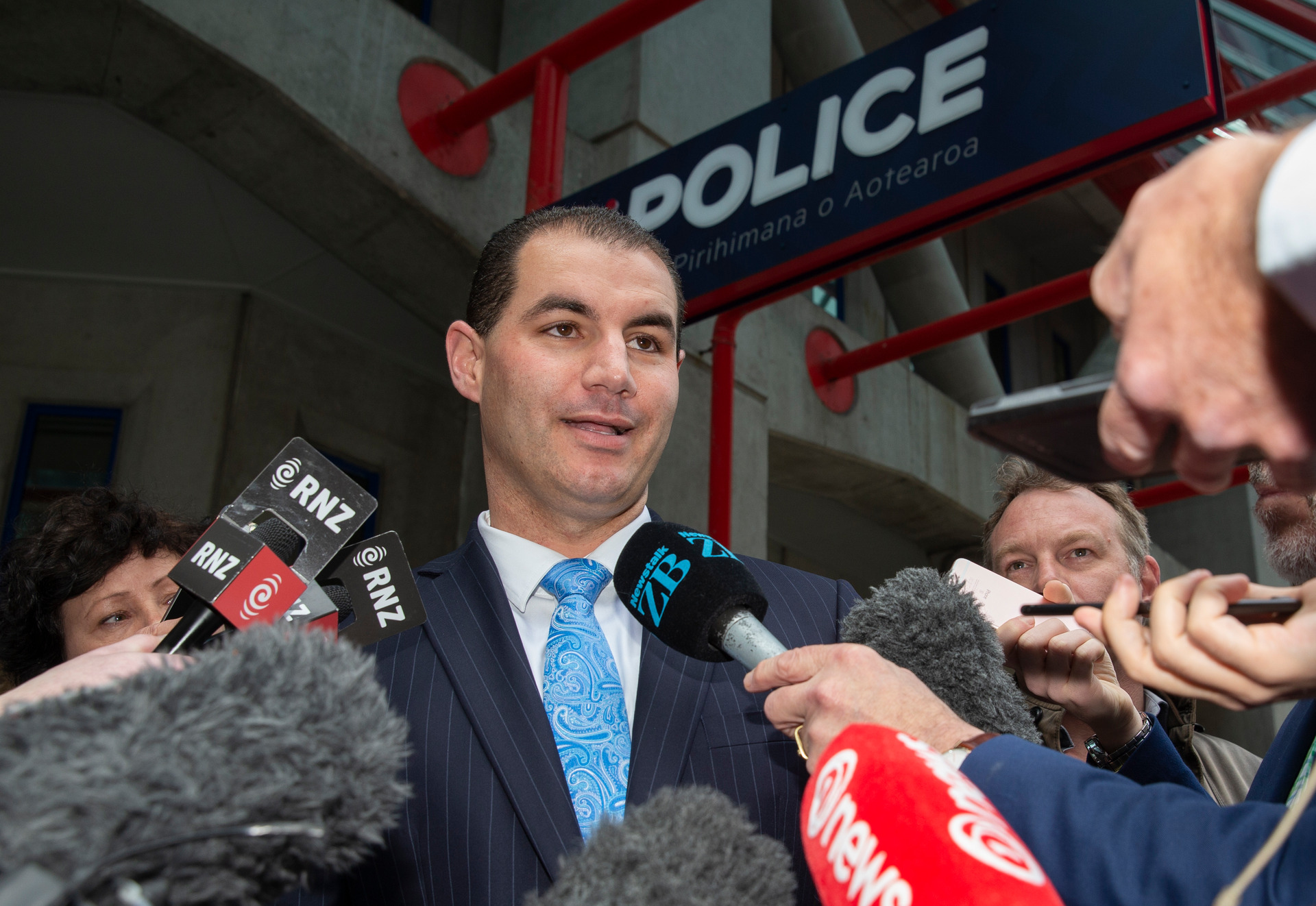 Jami-Lee Ross speaks to media outside the Wellington Central Police Station after he