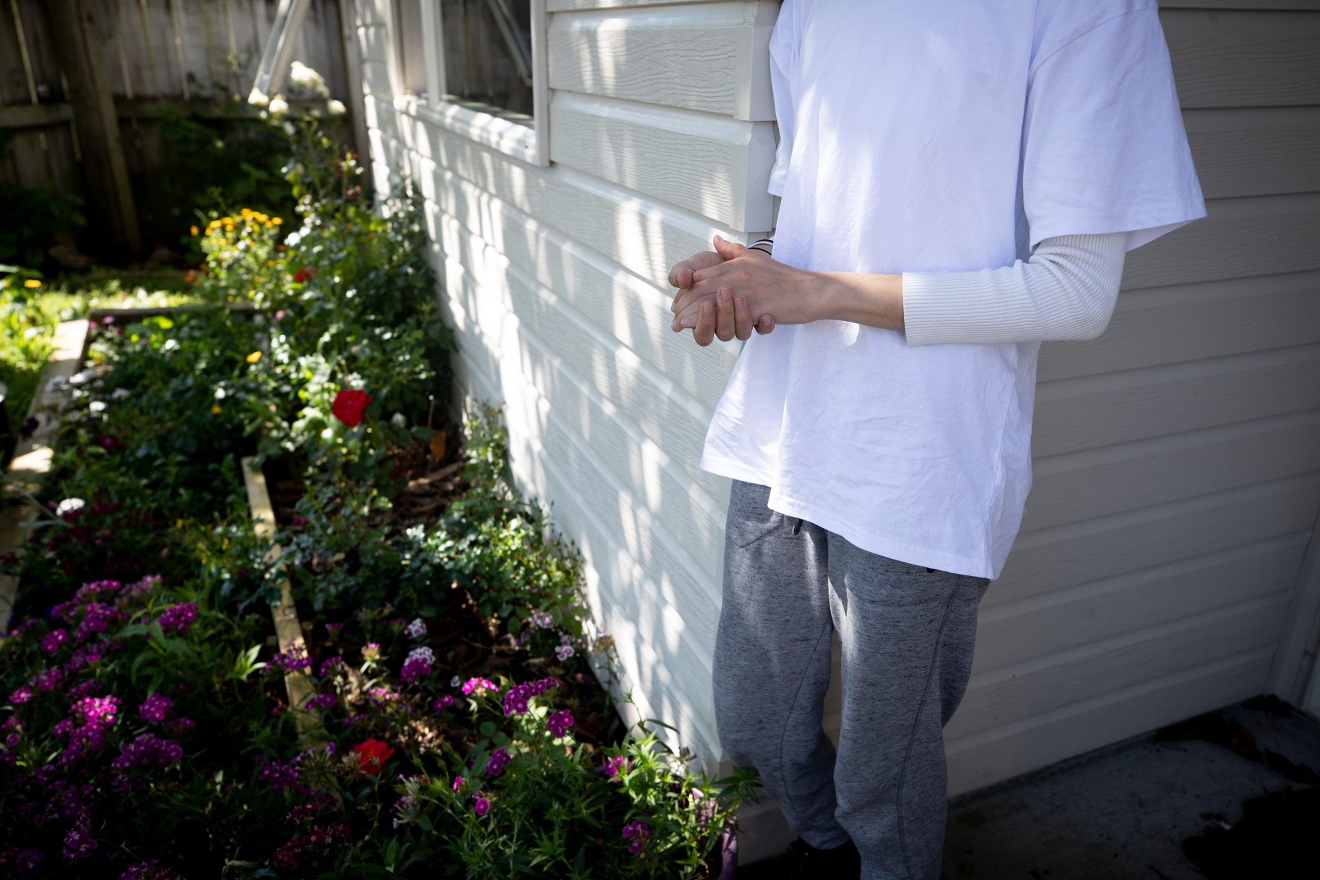 A floral tribute as the daughter of the 68-year-old Glen Eden man who died of Covid-19 while self-isolating at his home this week remembers her father and his colourful flower garden. Photo / Dean Purcell