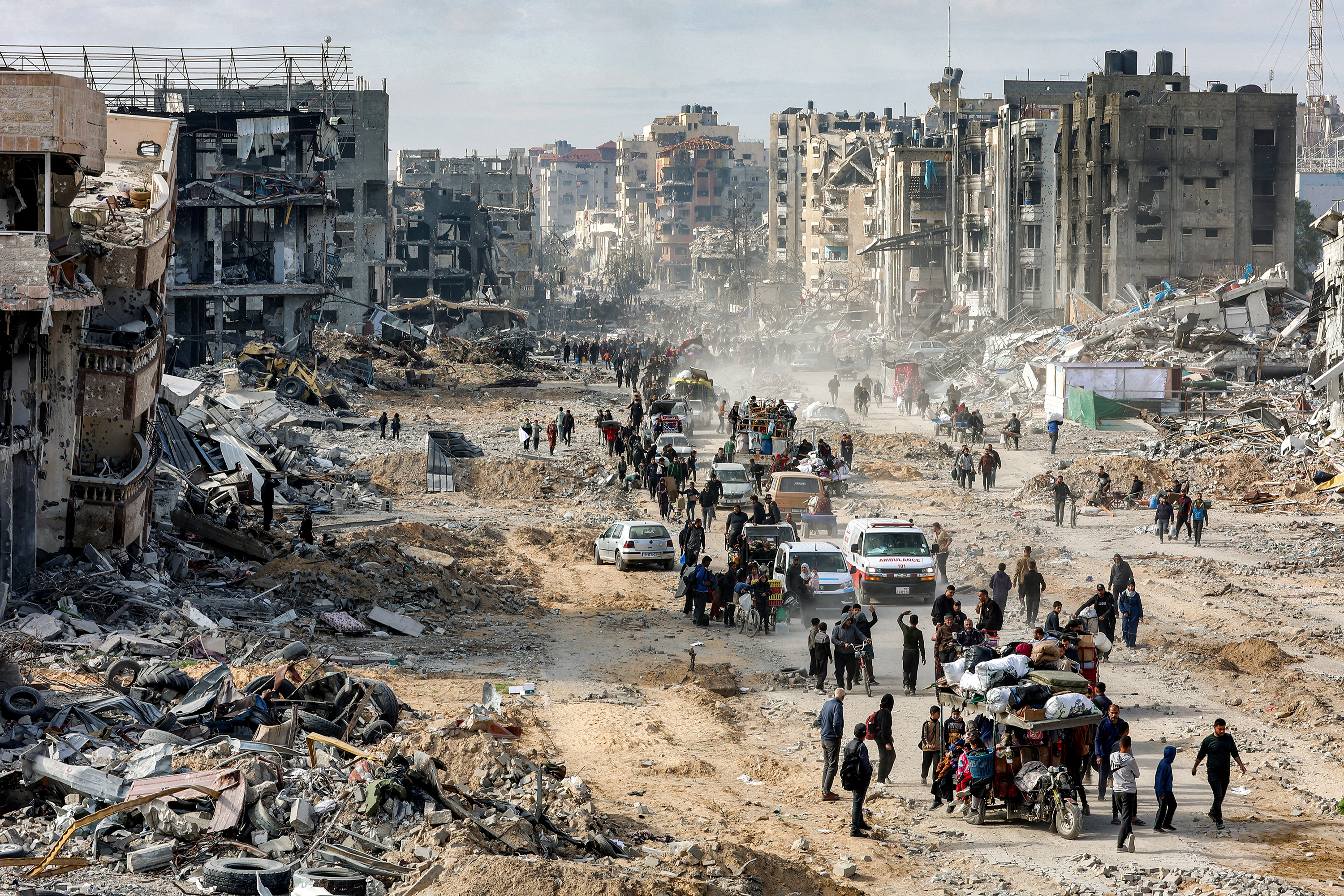 Residents walk past the rubble of collapsed buildings along Saftawi St in Jabalia in the northern Gaza Strip. Photo / AFP