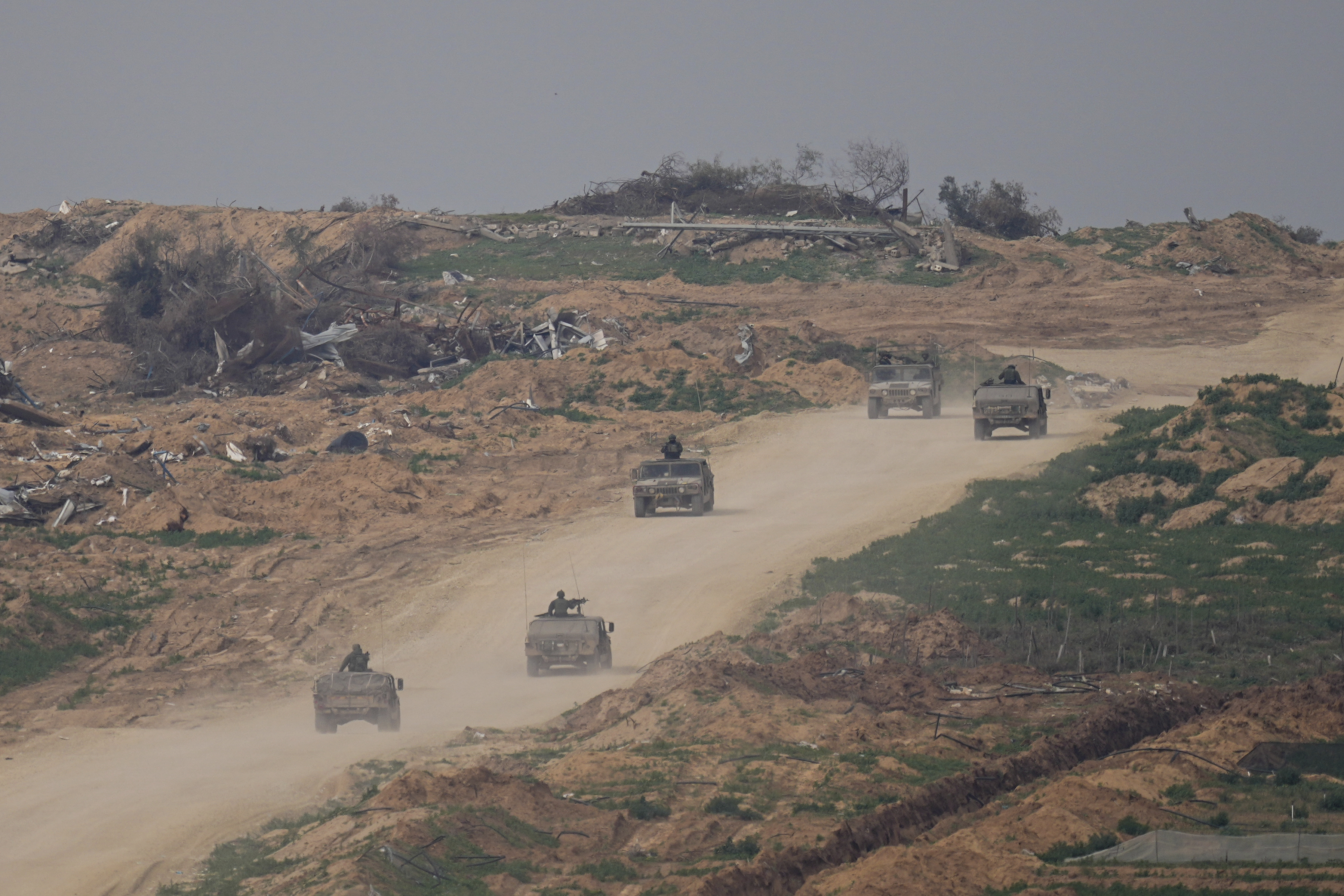 Israeli army vehicles move in the Gaza Strip near the Israeli-Gaza border. Photo / AP