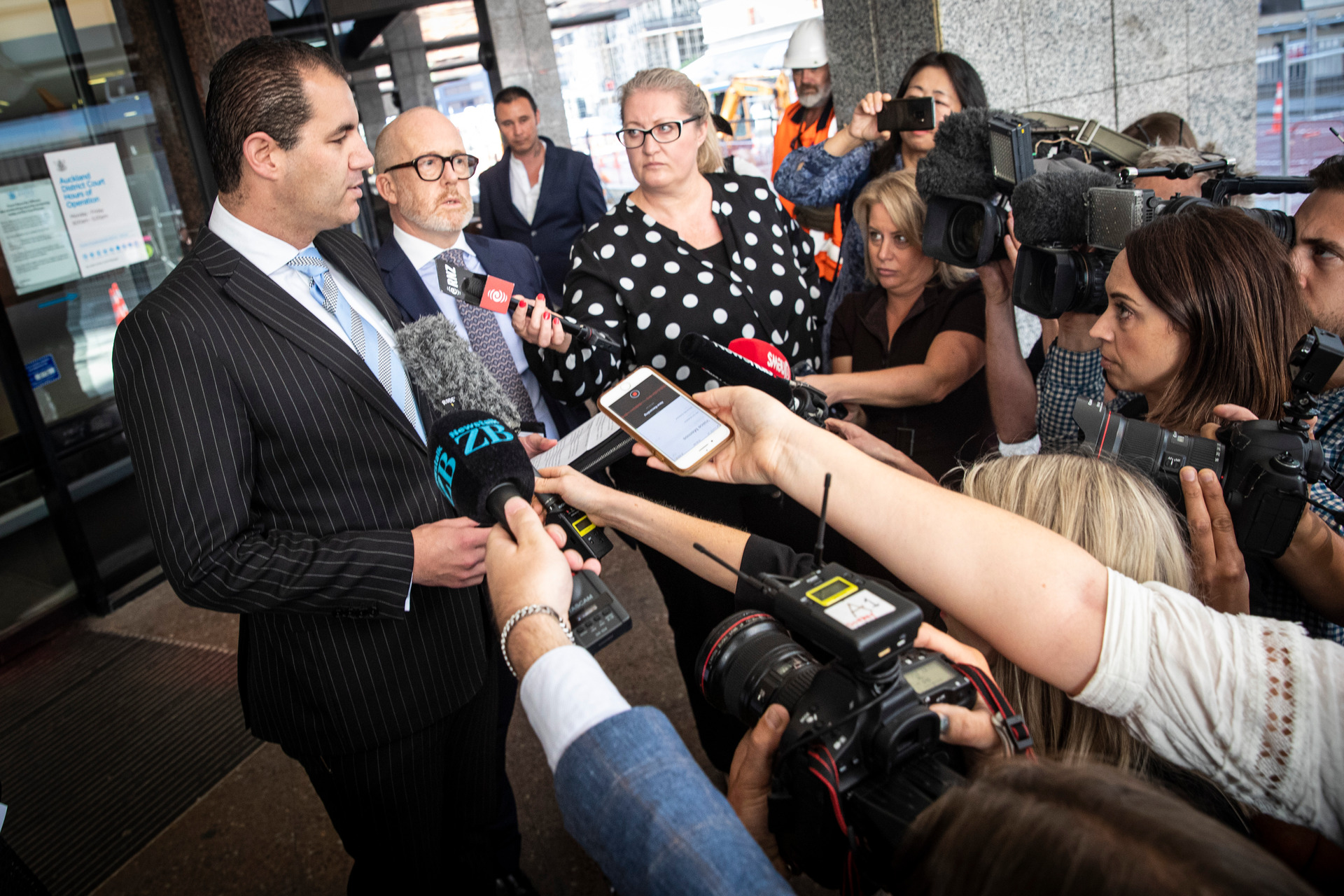 Jami-Lee Ross, next to his lawyer Ron Mansfield, speaks to reporters outside the Auckland District Court today. Photo / Jason Oxenham