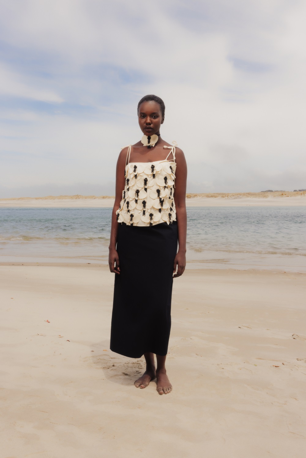 Featured in Viva's 2024 summer shoot, this Harris Tapper top has a cascade of hand-sewn orchid embellishments, made from 100% silk. Photo / Apela Bell