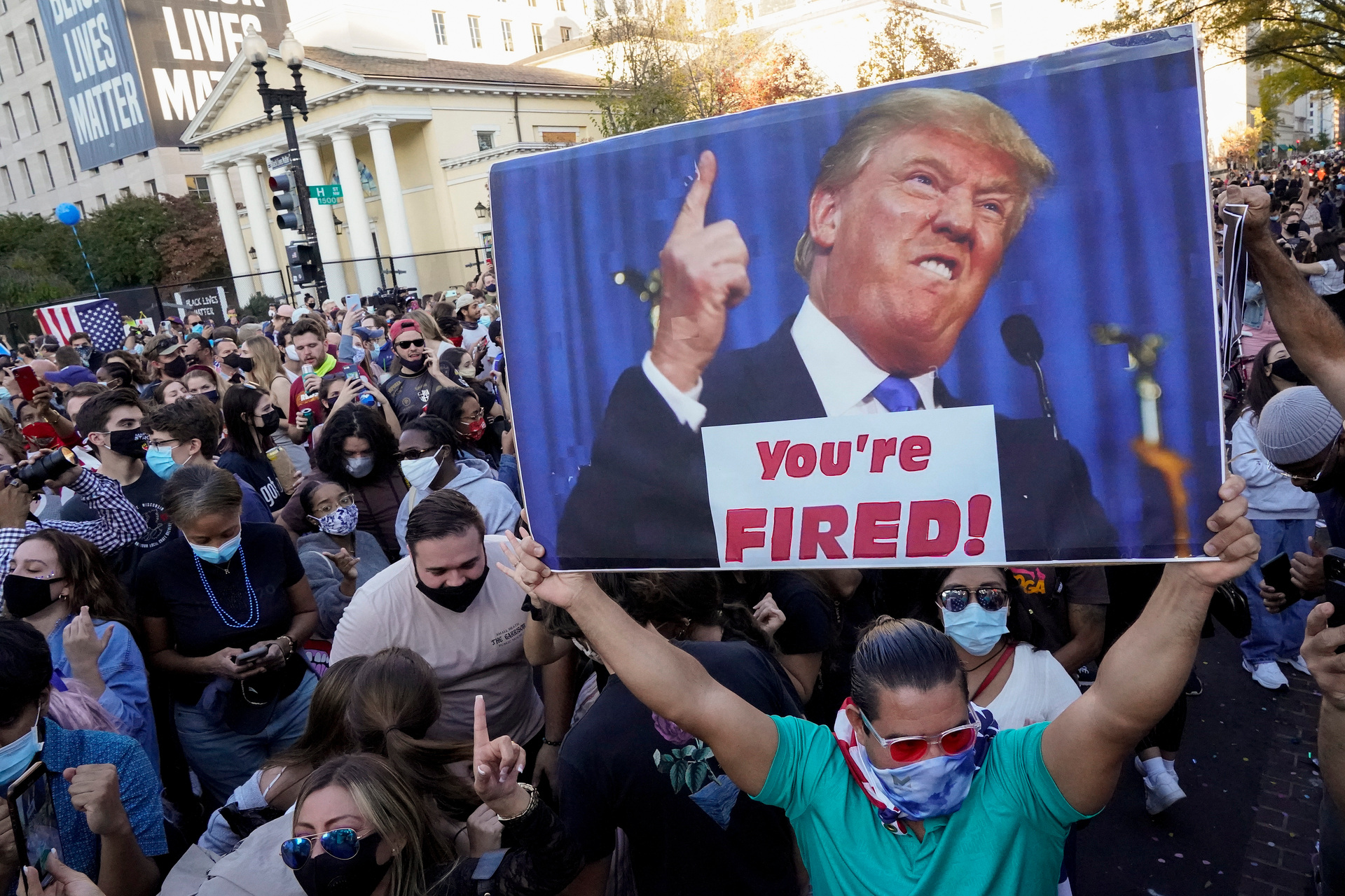 People gather in Black Lives Matter Plaza in Washington to celebrate President-elect Joe Biden's win over President Donald Trump. AP Photo / Jacquelyn Martin