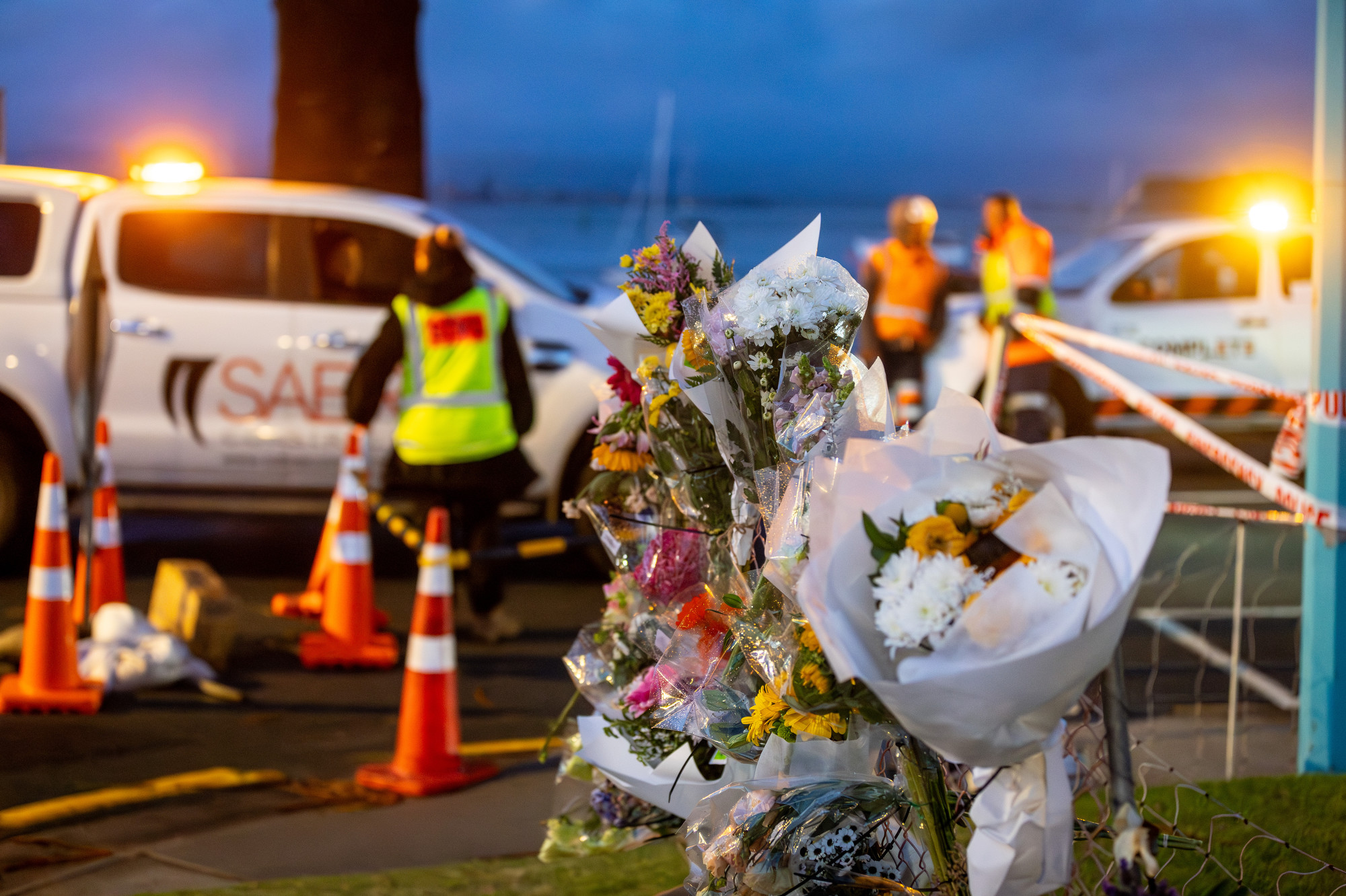 Floral tributes of remembrance left at The Mall, Pilot Bay. Photo / Michael Craig