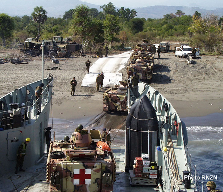 New Zealand Army armoured personnel carriers drive ashore at Suai, East Timor. Photo / Supplied