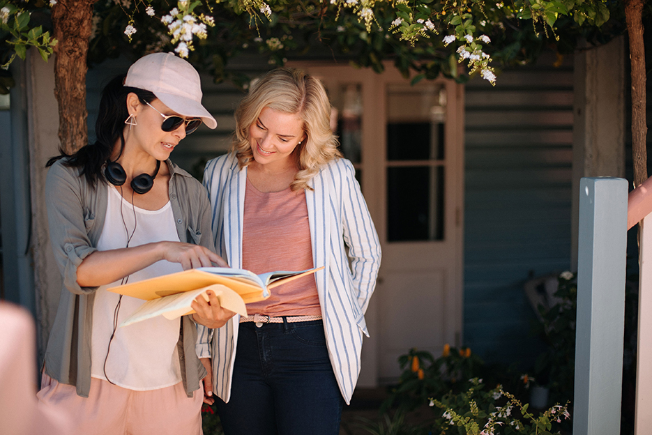 Rosie Lourde and Cindy Busby on the set of Romance on the Menu. Photo / The Steve Jaggi Company 