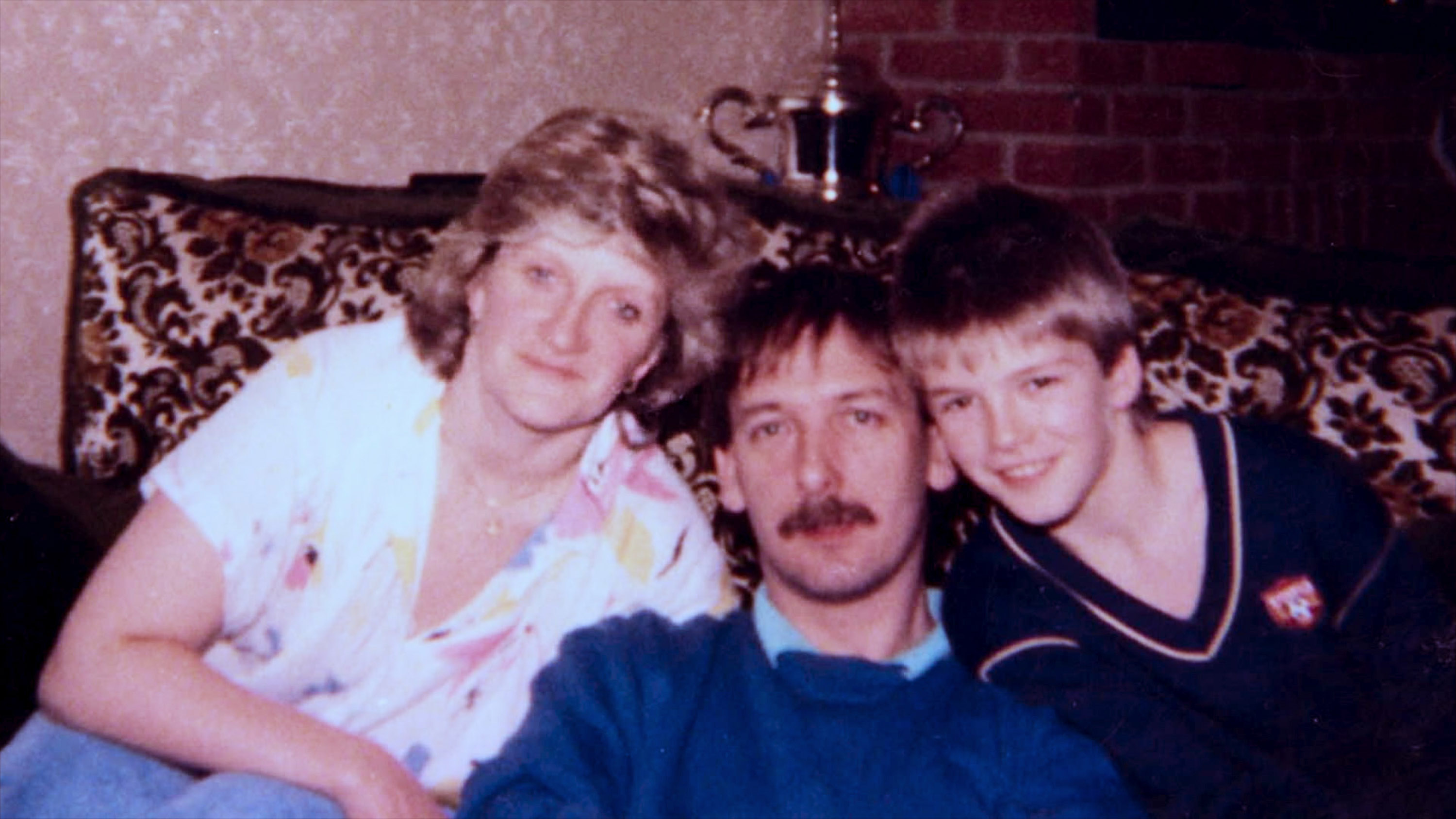 A young David Beckham with his parents, Sandra and Ted. Photo / Netflix