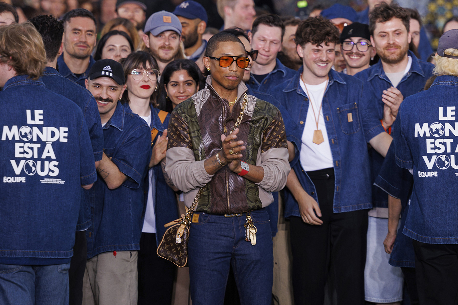 Creative director Pharrell Williams, centre, accepts applause following the Louis Vuitton Spring Summer 2025 collection. Photo / AP
