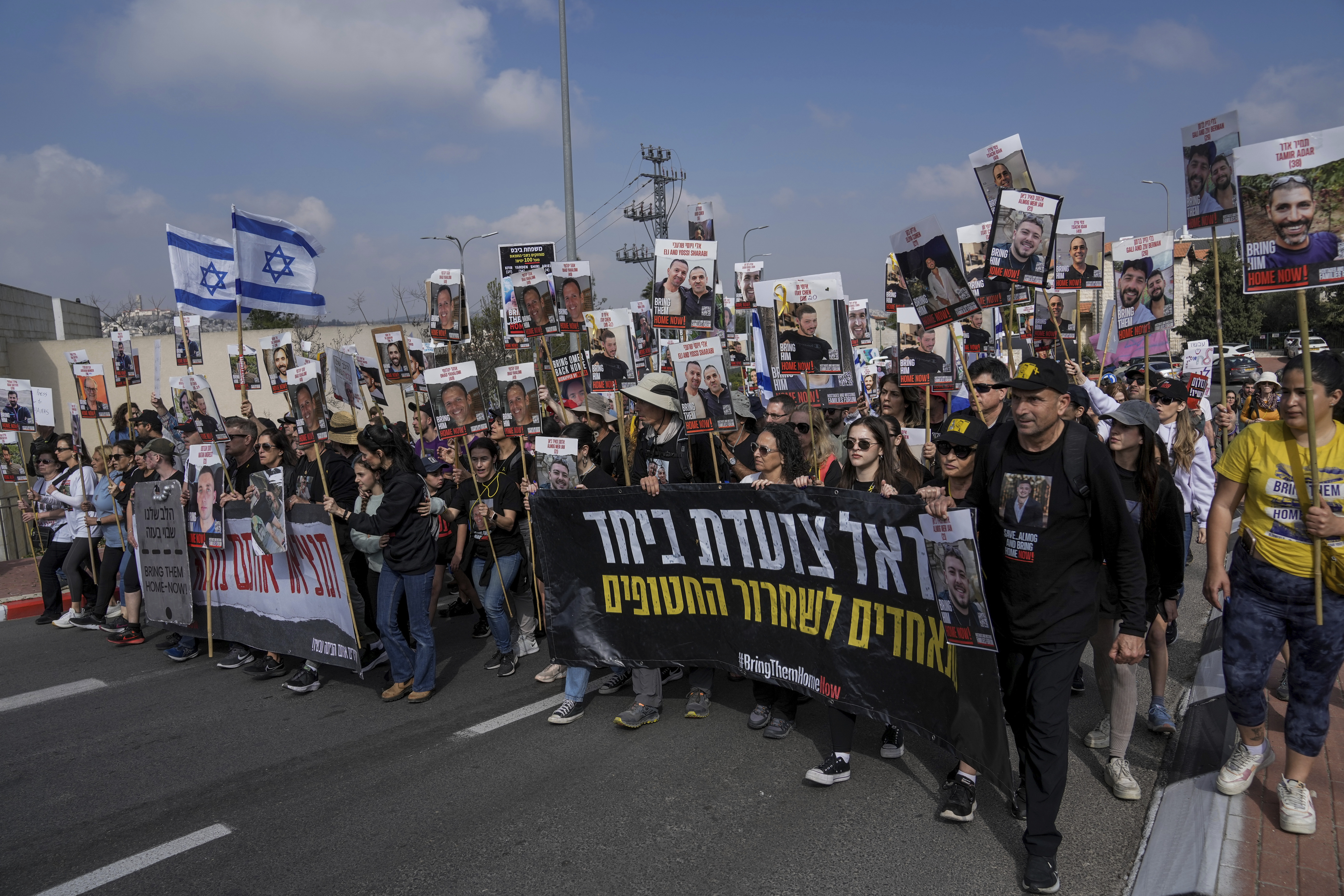 Family and supporters of the hostages held captive by Hamas in Gaza complete the final leg of a four-day march from the Israel-Gaza border to Jerusalem, to demand the immediate release of all hostages. Photo / AP