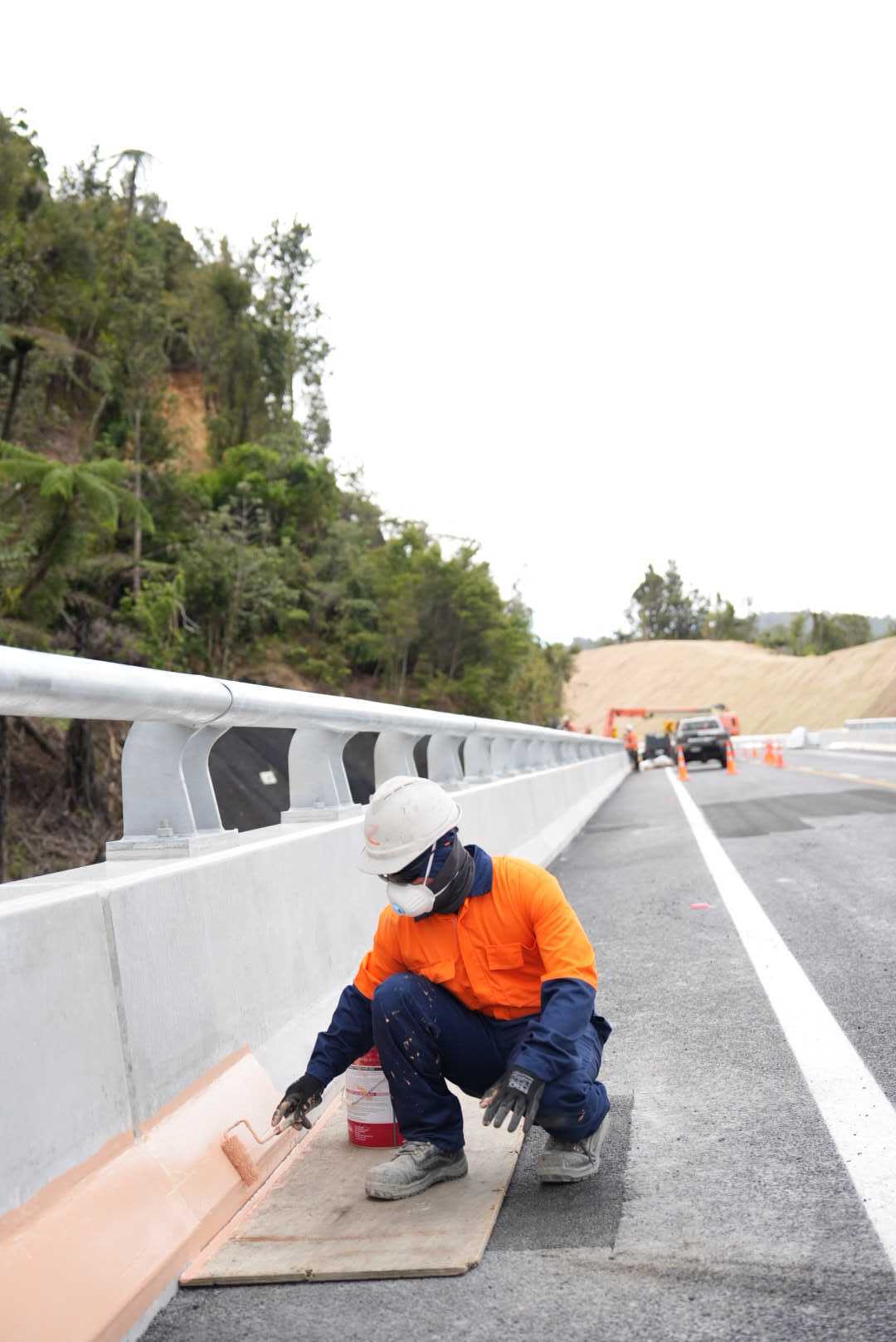 A worker on State Highway 25a. Photo / Corey Fleming