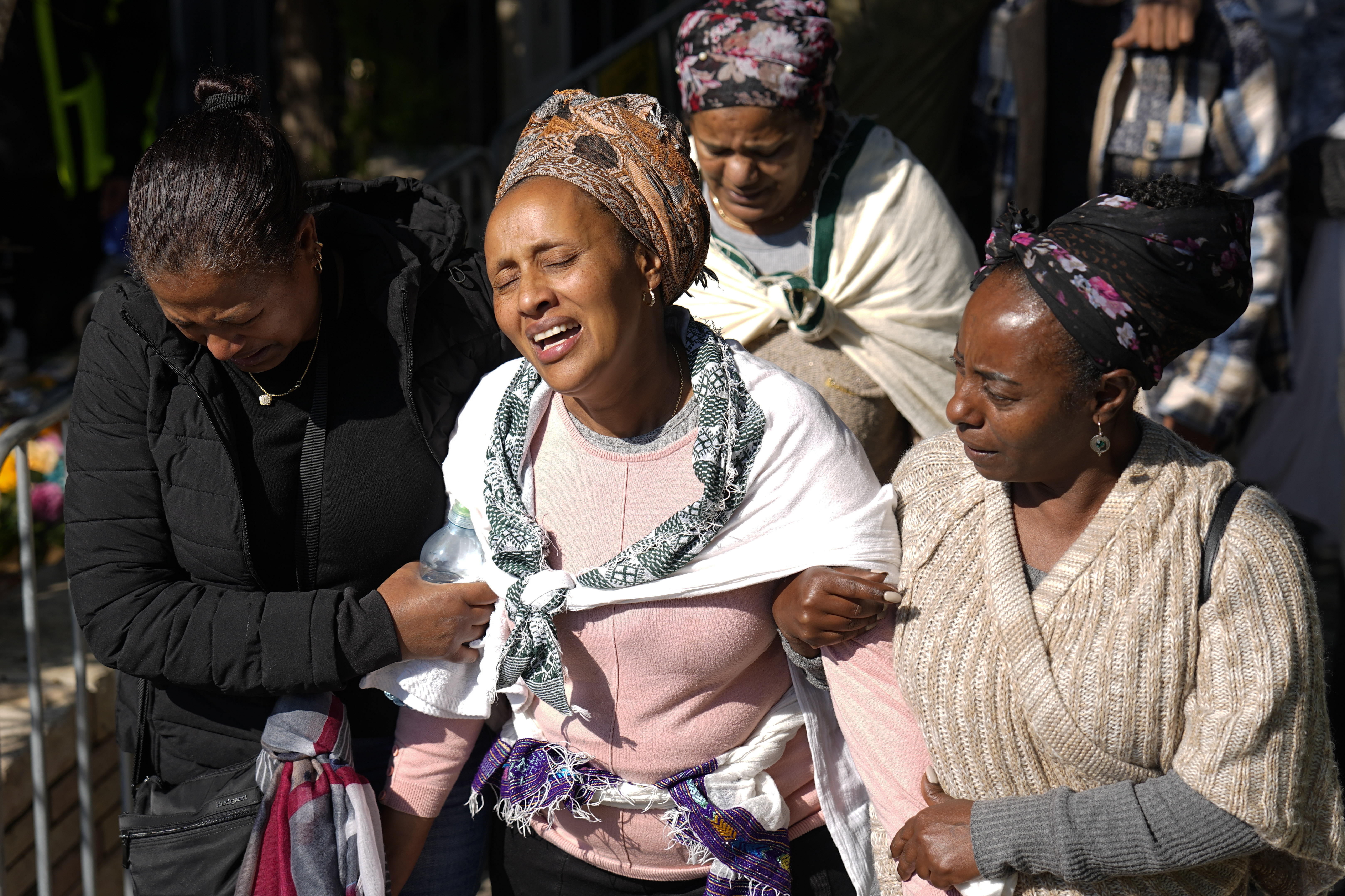 Bat Sheva (centre), mother of Israeli solider Staff sergeant Narya Belete, grieves during his funeral in Netanya, Israel. Photo / AP