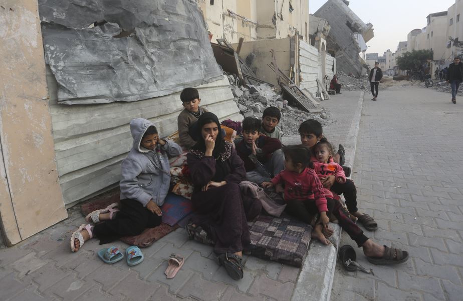 Palestinians fleeing the Israeli bombardment of the Gaza Strip arrive in Rafah on December 27. (AP Photo/Hatem Ali)