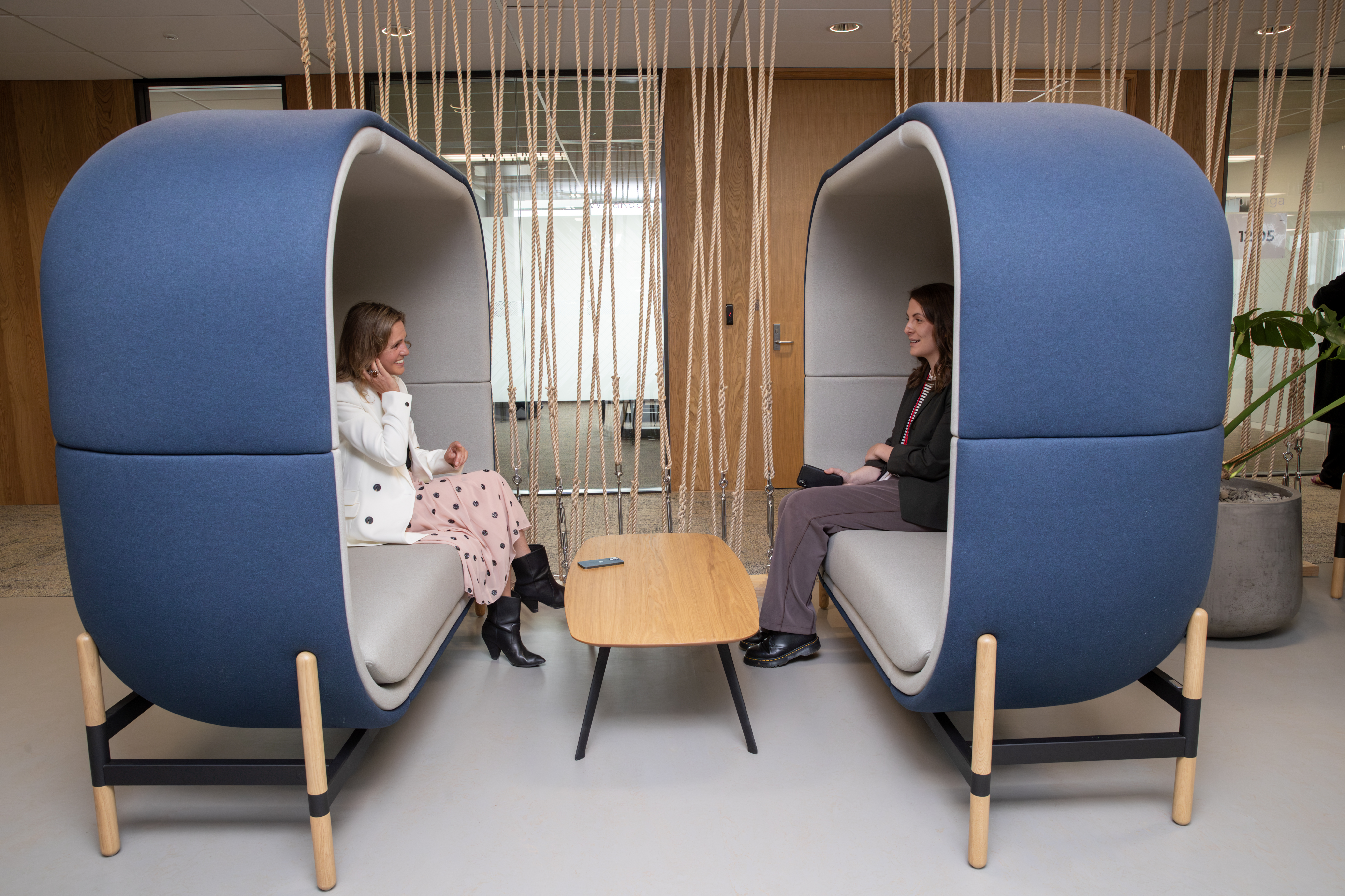 Datacom Futures Insights and Experience associate director Tracey Cotter-Martin and NZ Herald reporter Georgina Campbell in one of Datacom's meeting pods. Photo / Mark Mitchell