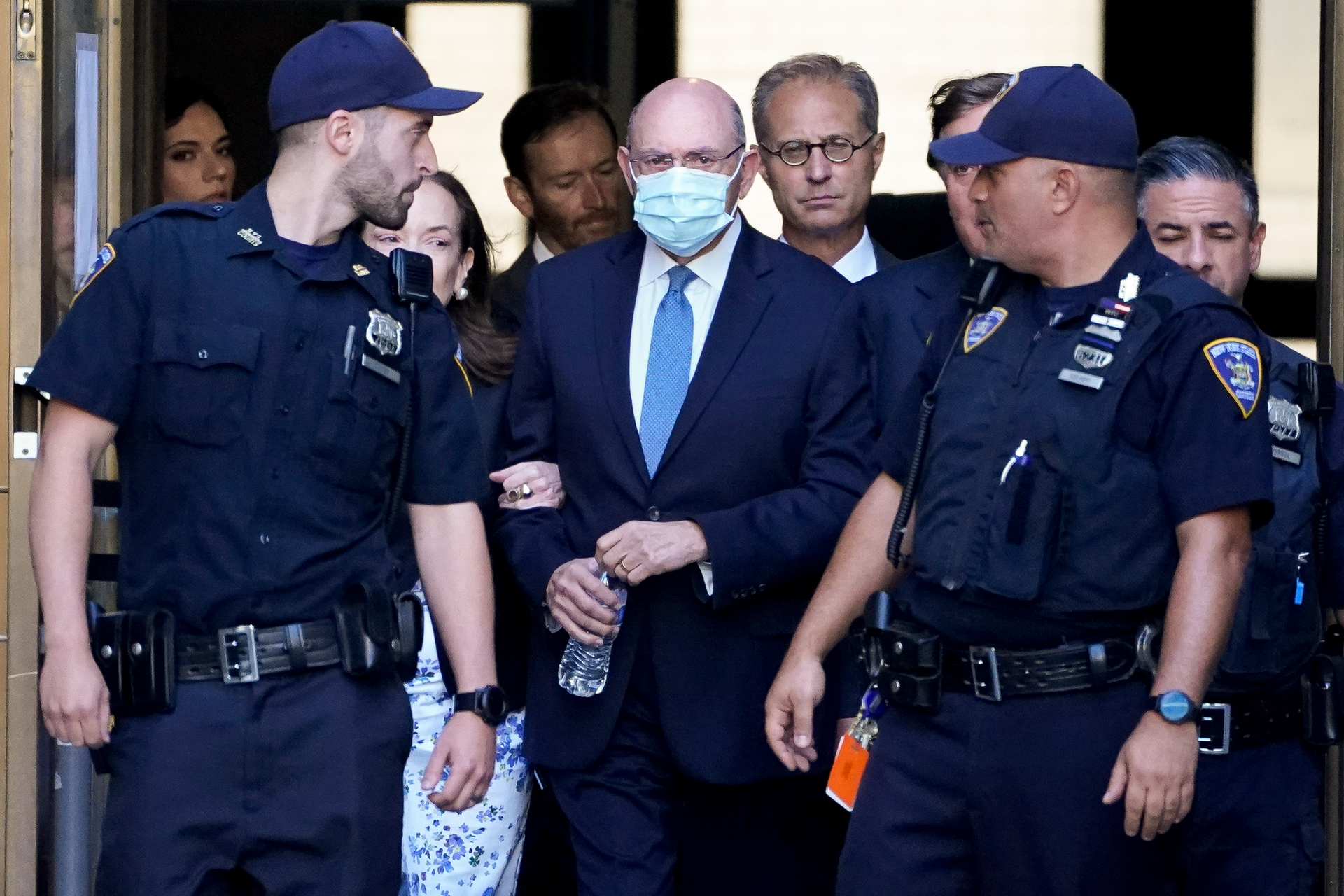Trump Organisation's former Chief Financial Officer Allen Weisselberg, centre, leaves court in New York. Photo / John Minchillo, AP