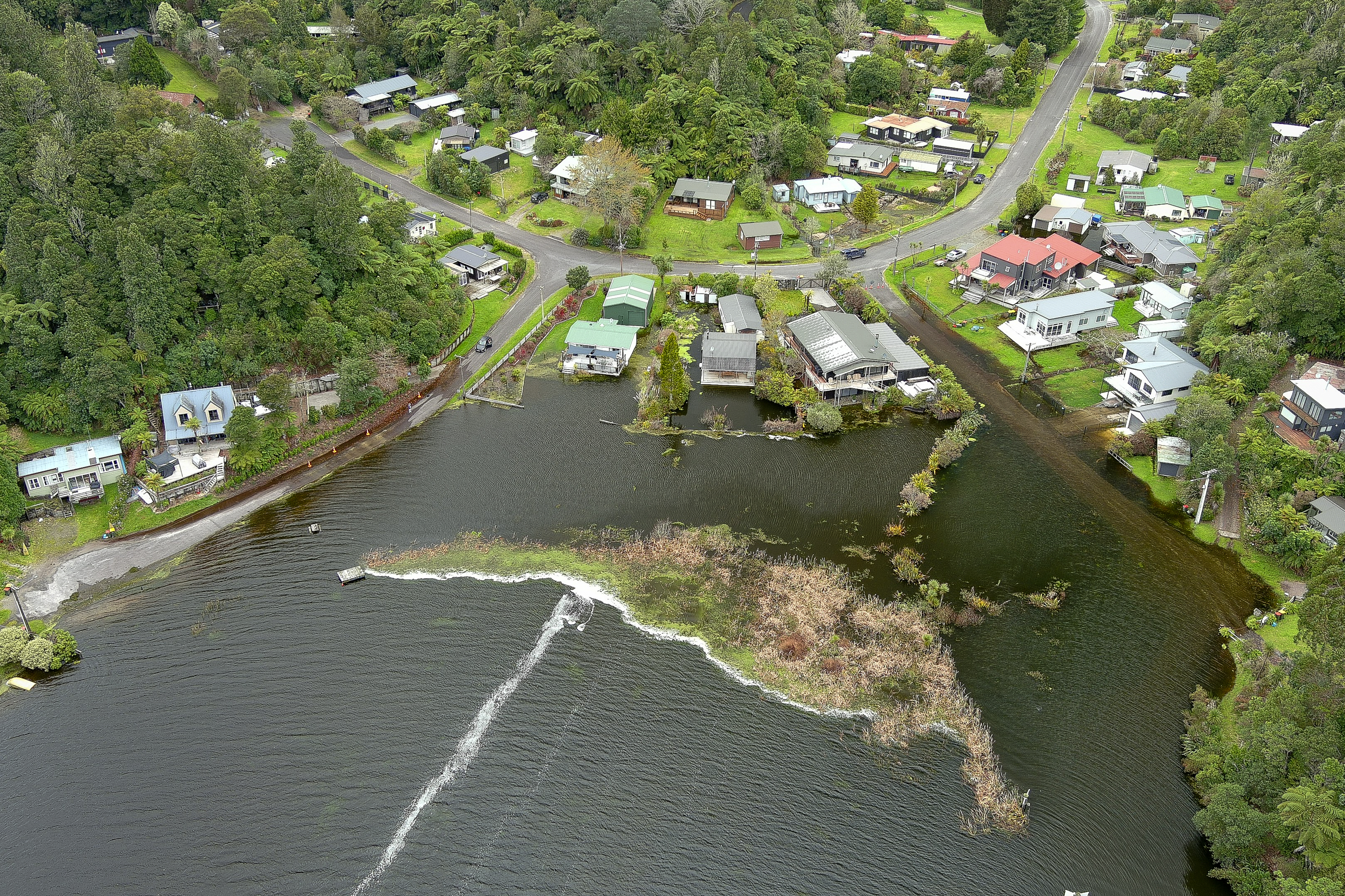 Homes in Ōtautū Bay at Lake Rotoehu are being inundated as lake levels near record heights. Photo / Andrew Warner