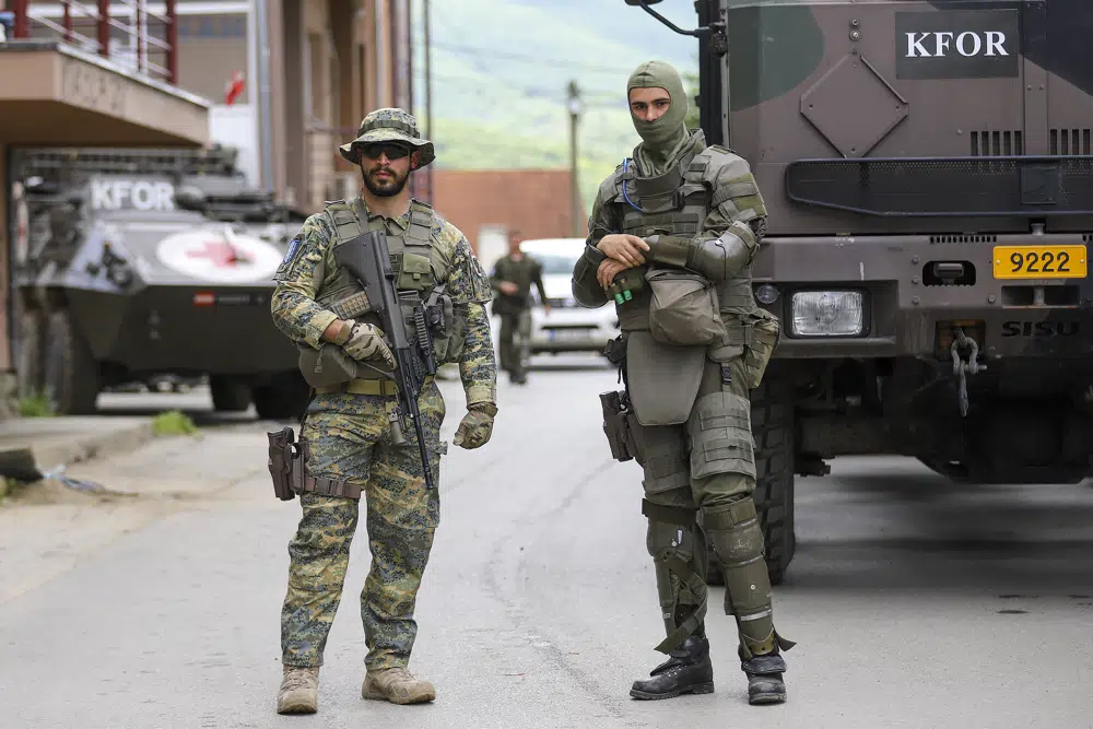 German KFOR soldiers guard municipal building after yesterday's clashes. Photo / AP