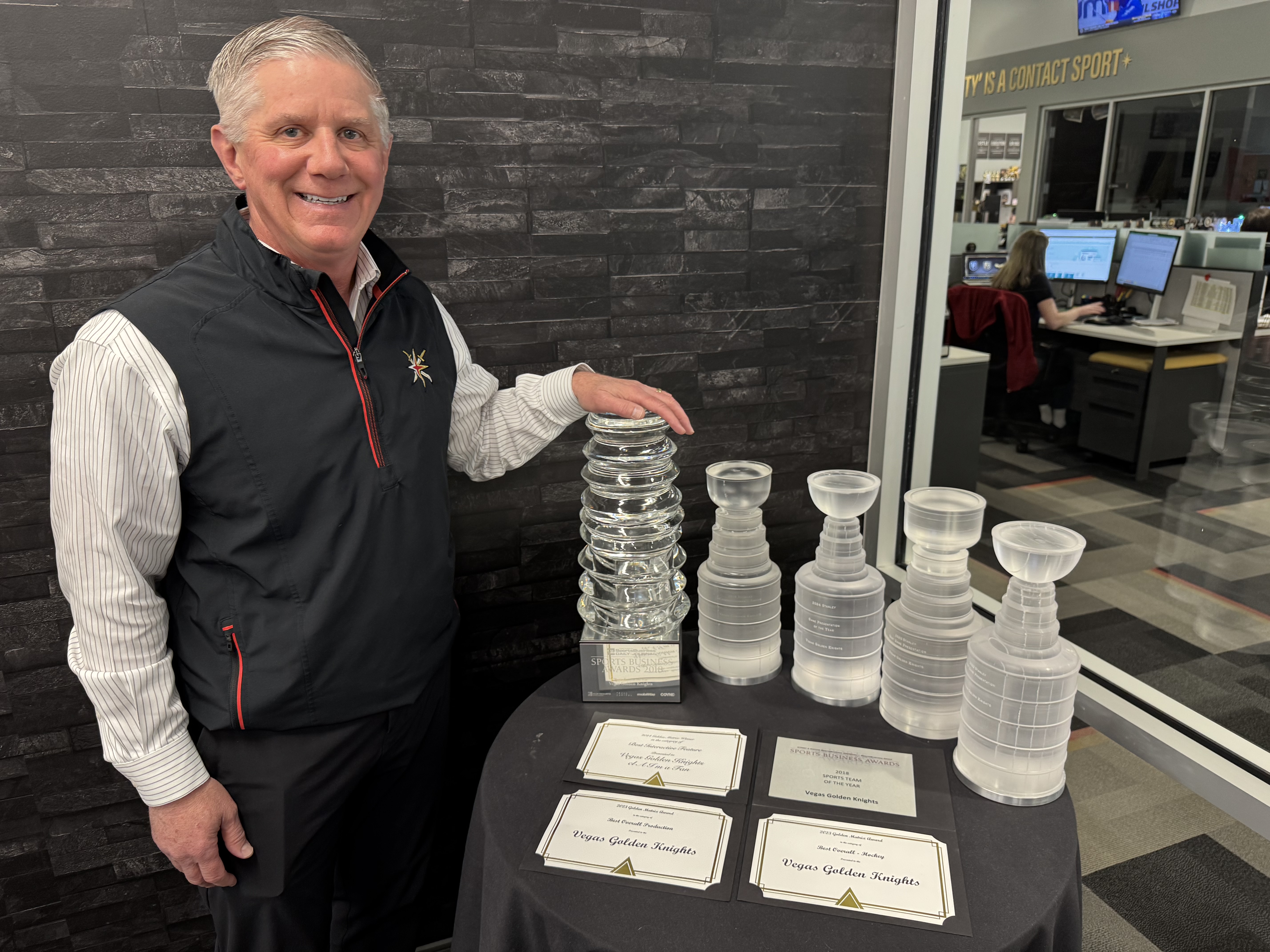 Las Vegas Golden Knights chief eecutive Kerry Bubolz with just a few of the club’s major awards. Photo / Dean McLachlan