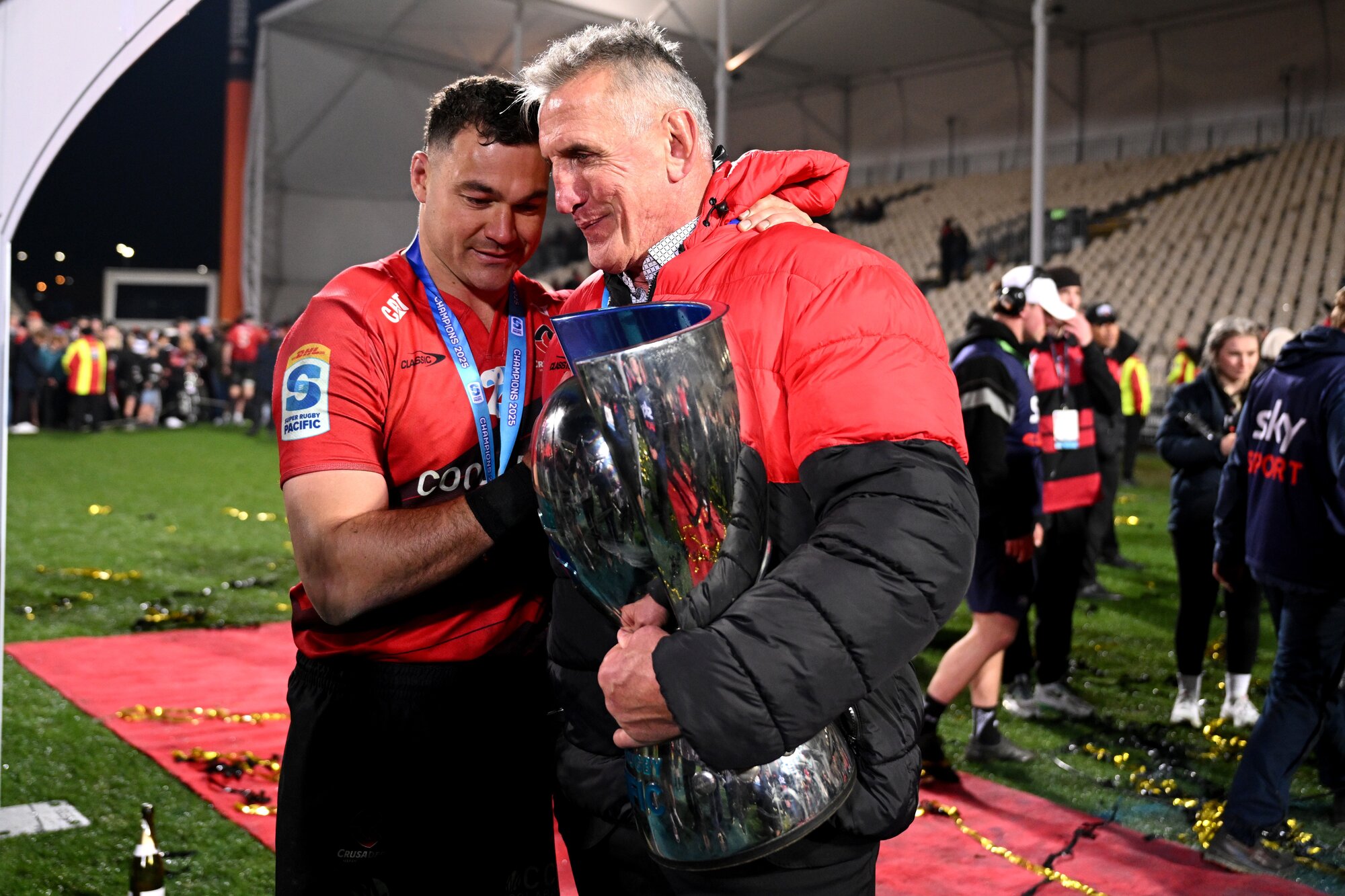 Crusaders captain David Havili (left) and coach Rob Penney celebrate after winning the 2025 Super Rugby Pacific final against the Chiefs. Photo / Getty Images