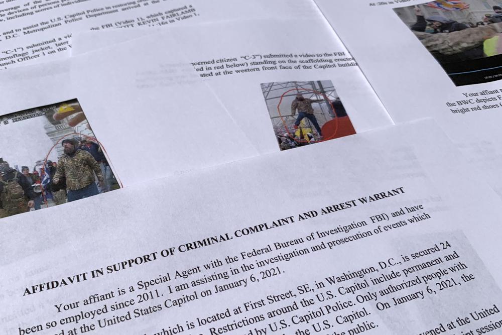 The affidavit from the FBI in support of an arrest warrant for Scott Kevin Fairlamb is photographed on August 6 last year. Photo / AP