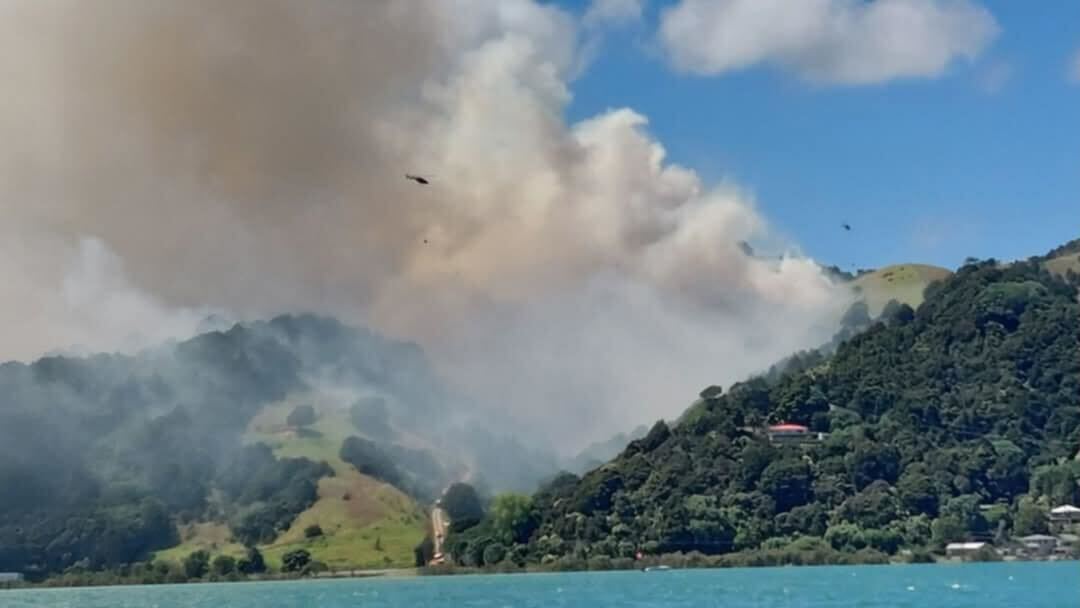 Ten trucks and five helicopters responded to a vegetation fire on Whangārei Heads. Photo / Supplied