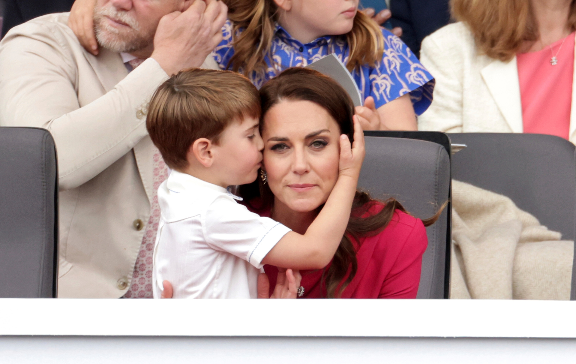 Prince Louis hugs Kate, Duchess of Cambridge, during the Platinum Jubilee Pageant held outside Buckingham Palace in London. Photo / AP