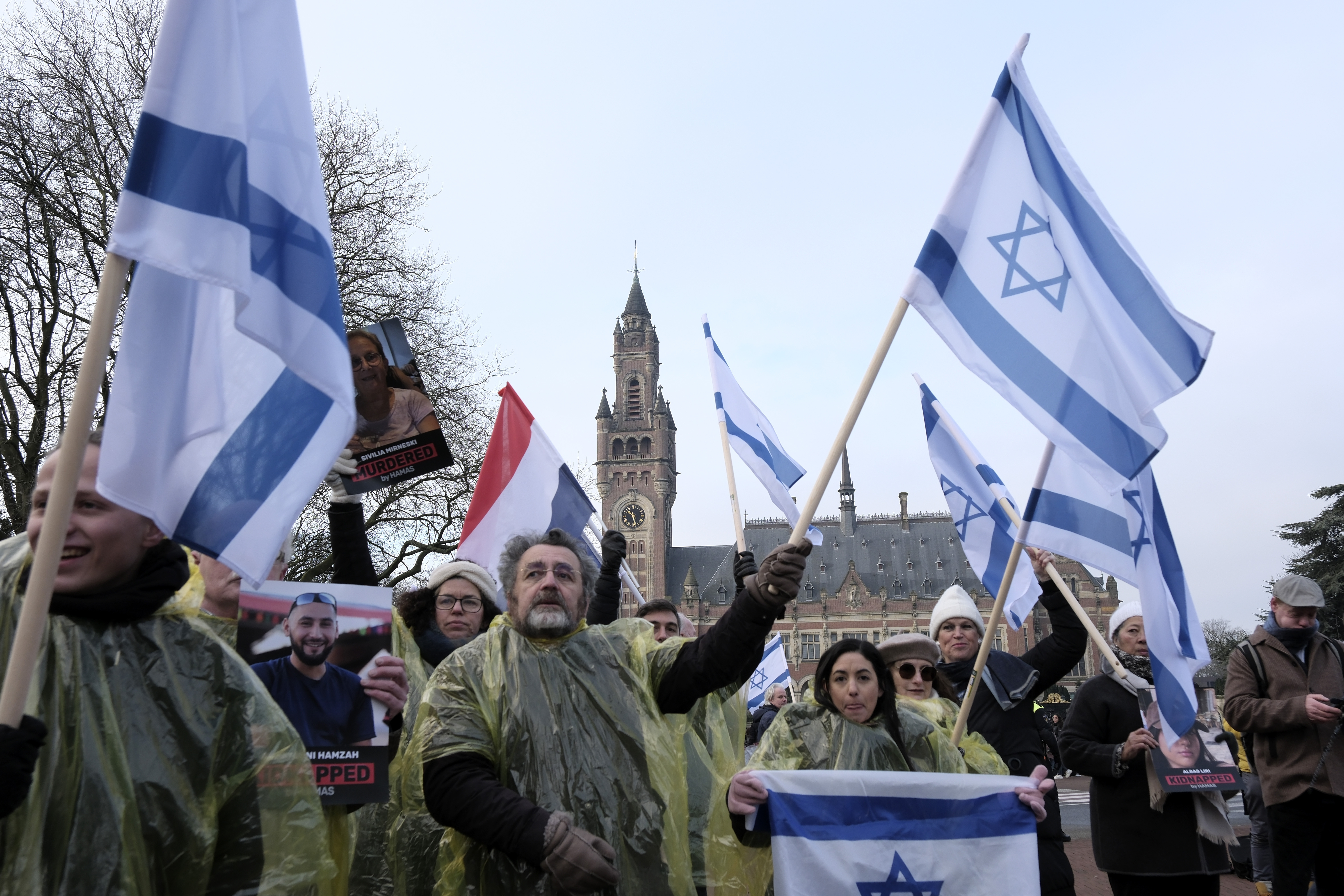 Protesters wave Israeli flags and hold photos of the hostages kidnapped during the October 7 Hamas cross-border attack in Israel. Photo / AP