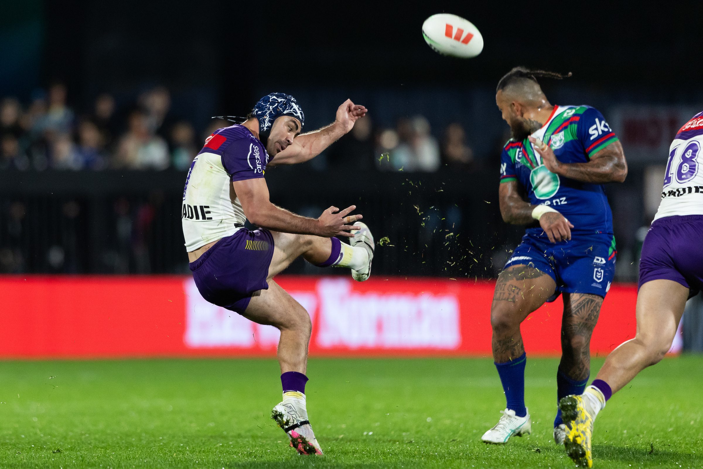 Jahrome Hughes puts in a kick at Go Media Stadium Mt Smart as Addin Fonua-Blake takes evasive action. Photo / Photosport