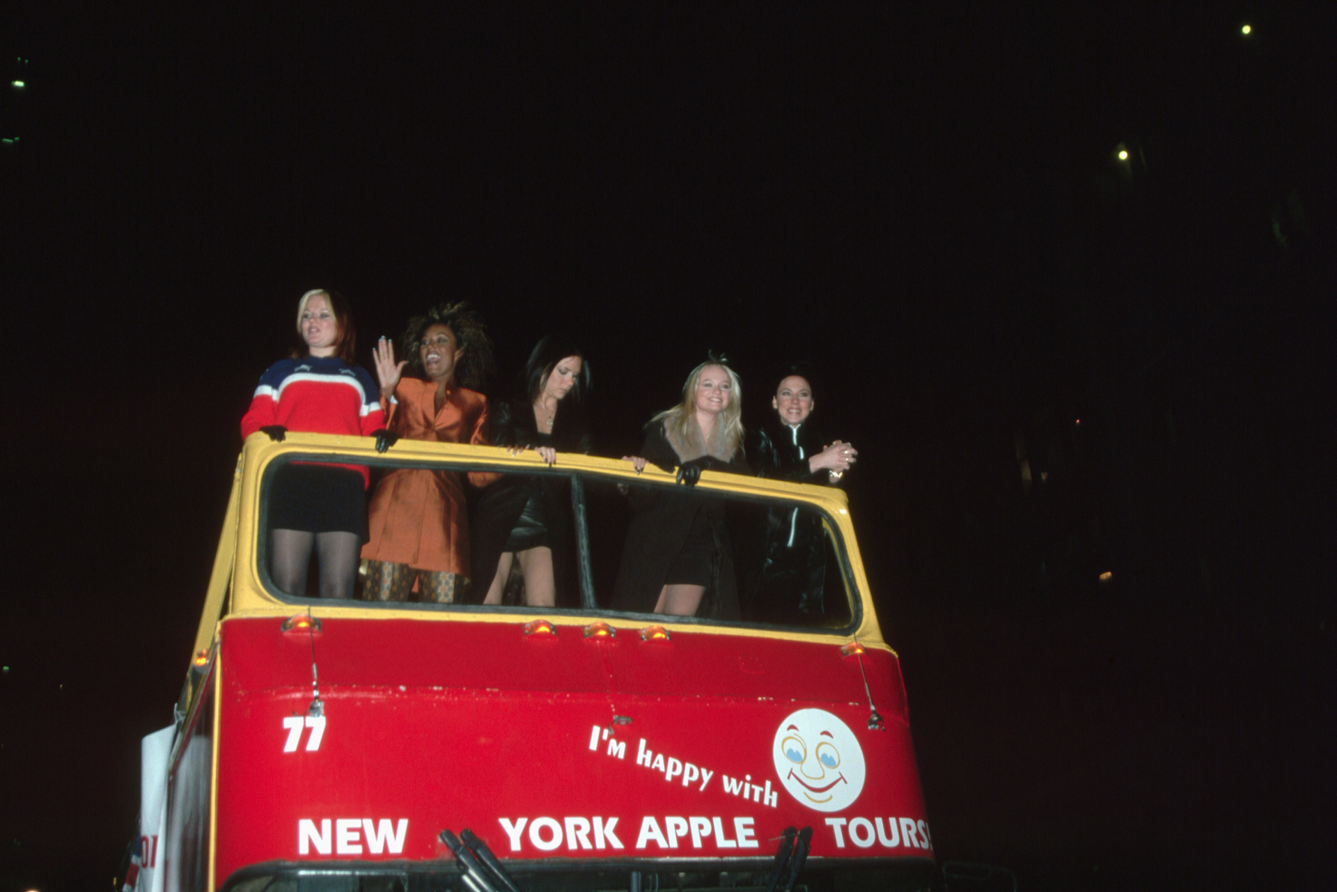 Horner, Brown, Beckham, Bunton and Chisholm arriving - aboard a double-decker bus - at a 1998 screening of their film Spice World in New York. Photo / Getty Images