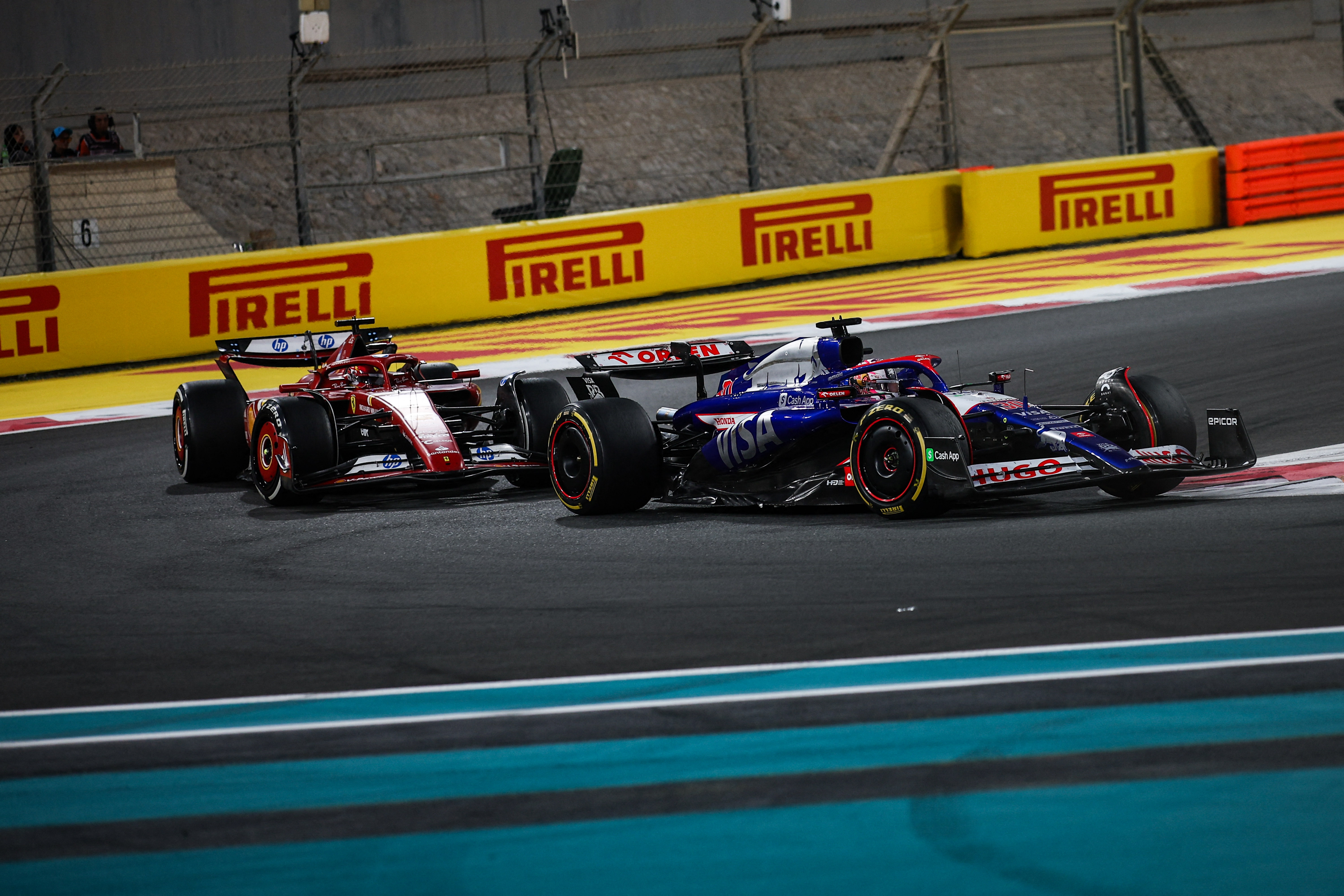 Liam Lawson with Ferrari's Carlos Sainz behind him during the Abu Dhabi Grand Prix. Photo / AFP