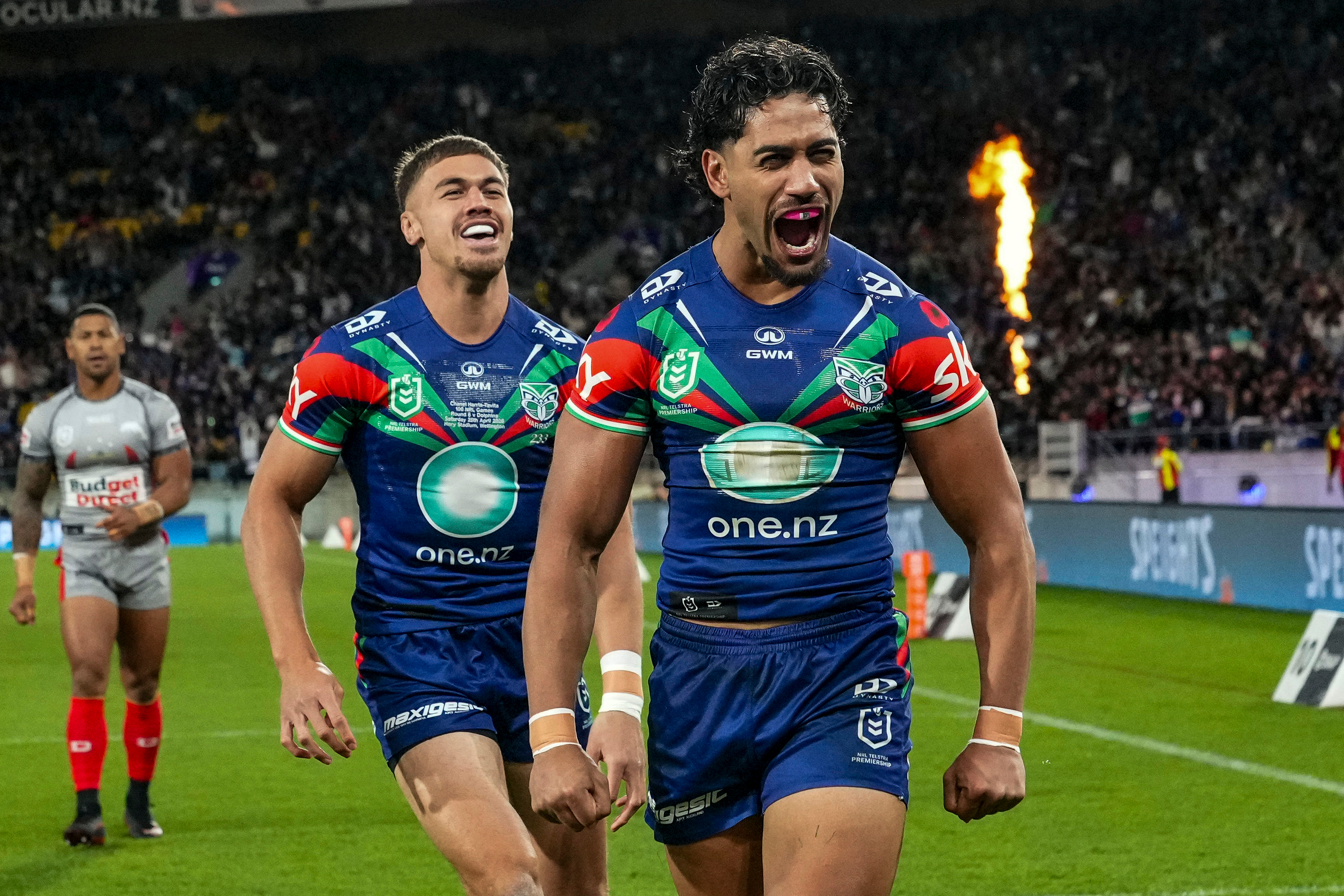 Alofiana Khan-Pereira, of the Warriors, celebrates scoring against the Dolphins. Photo / Photosport