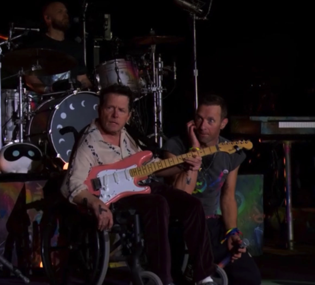 Michael J. Fox on stage with Coldplay singer Chris Martin at Glastonbury 2024. Photo / via BBC