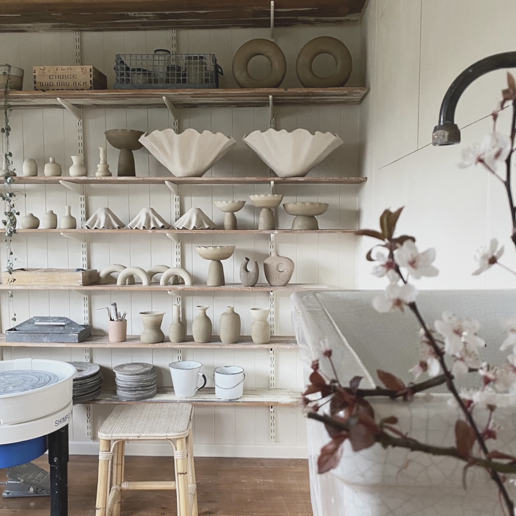 Finished ceramics line the walls of Deborah’s studio.