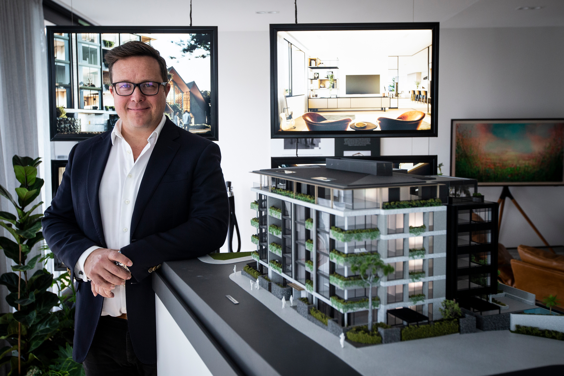 Martin Cooper with a model of the new apartments in Parnell. Photo / Jason Oxenham