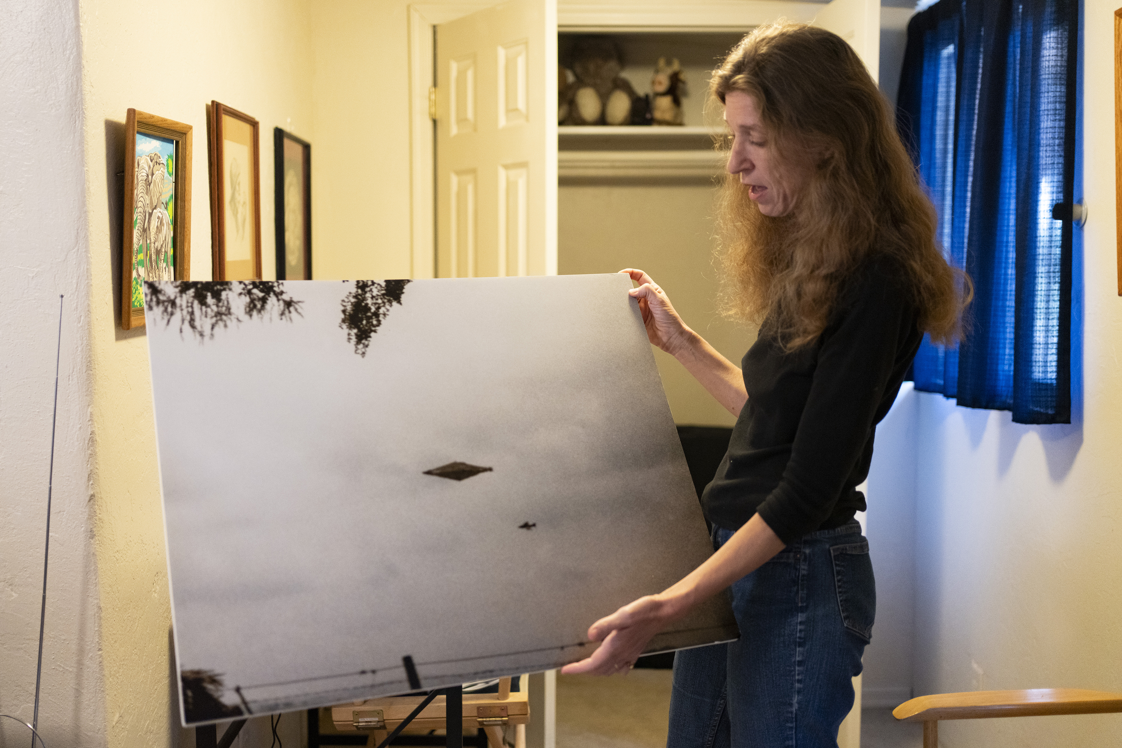 Elizabeth Weiss shows a photo of the Calvine UFO, the last thing her late husband Nick Pope gave interviews about, at her home in Tucson, Arizona on May 6, 2025. Photo / Rebecca Noble, The New York Times