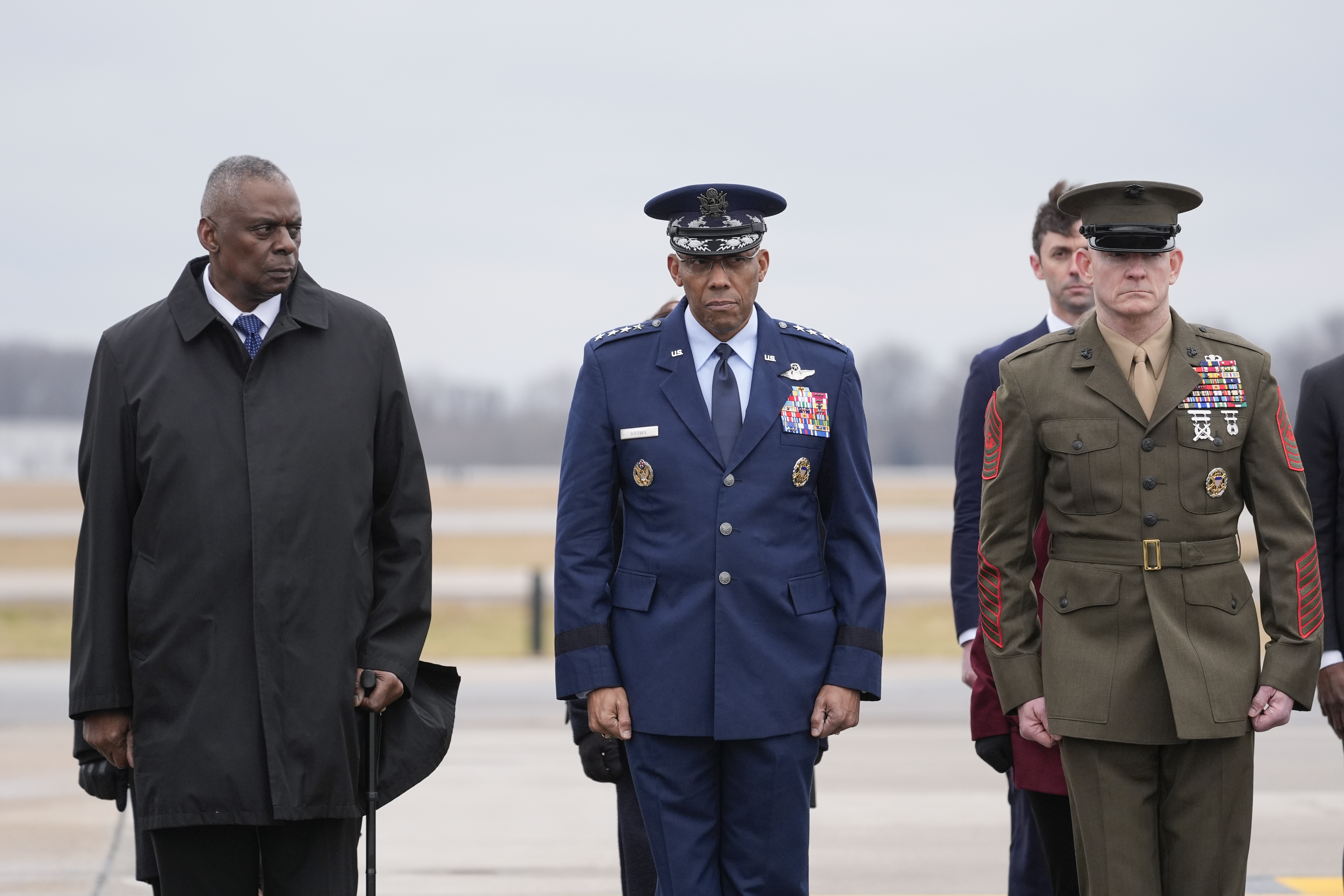 Defense Secretary Lloyd Austin, Chairman of the Joint Chiefs of Staff Gen. CQ Brown and Marine Corp. Sgt. Maj. Troy E. Black watch as an Army carry team moves the flag-draped transfer case containing the remains of U.S. Army Sgt. Kennedy Ladon Sanders. Photo / AP