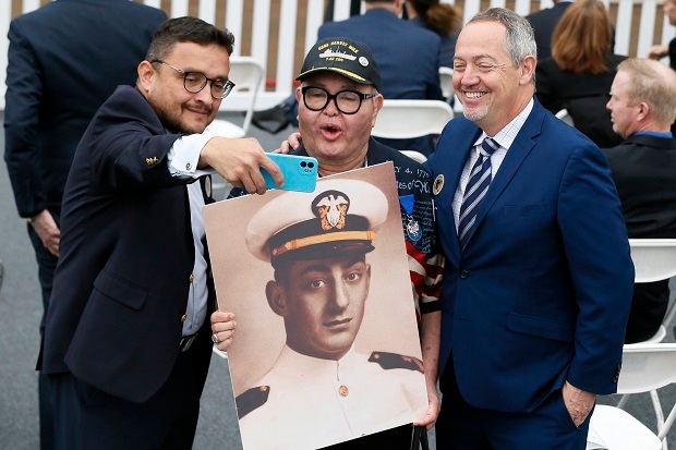 David Campos takes a selfie with Nicole Murray-Ramirez an LGBT activist, holding a photo of Harvey Milk, and Bevan Dufty. Photo / AP