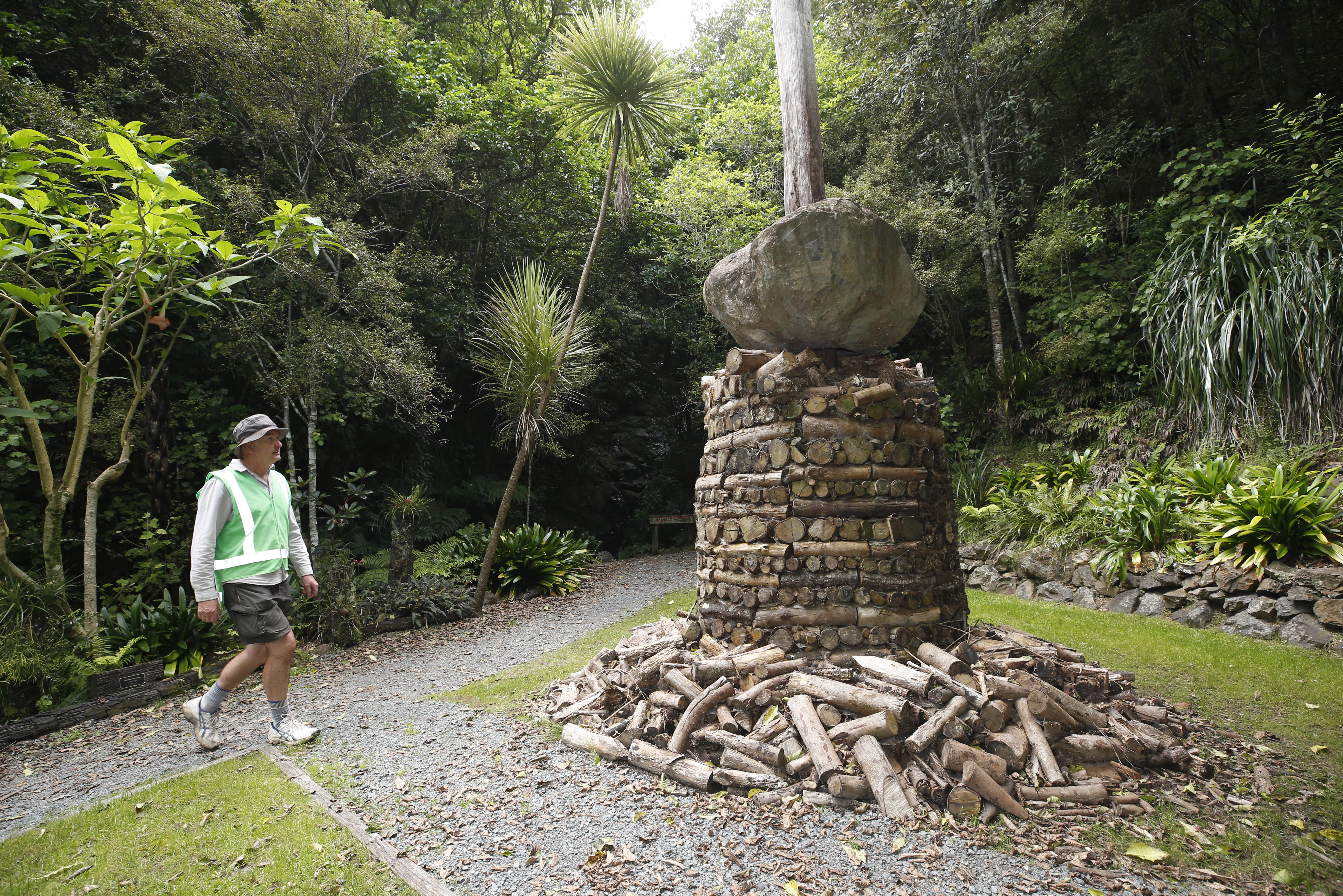 Garden Manager Guy Hessell with Chris Booths' sculpture, Te Wai U O Te Atakura, which has now been destroyed by landslides. Photo / Michael Cunningham