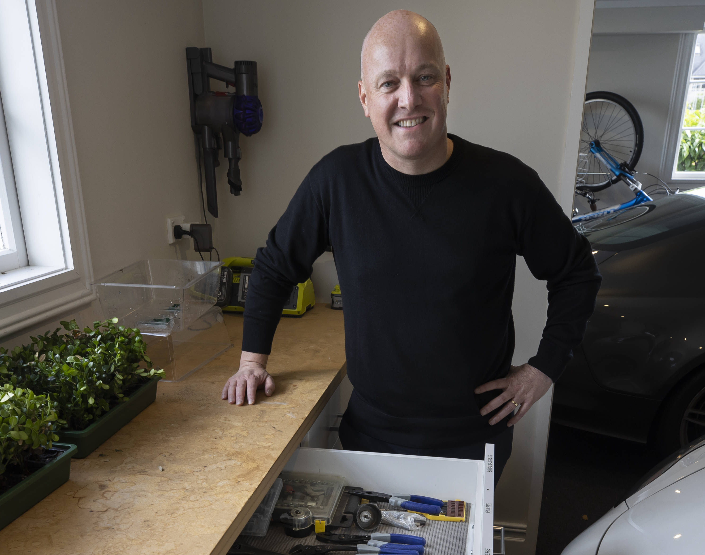 National Party leader Christopher Luxon in his own garage at home in Auckland. Photo / Brett Phibbs