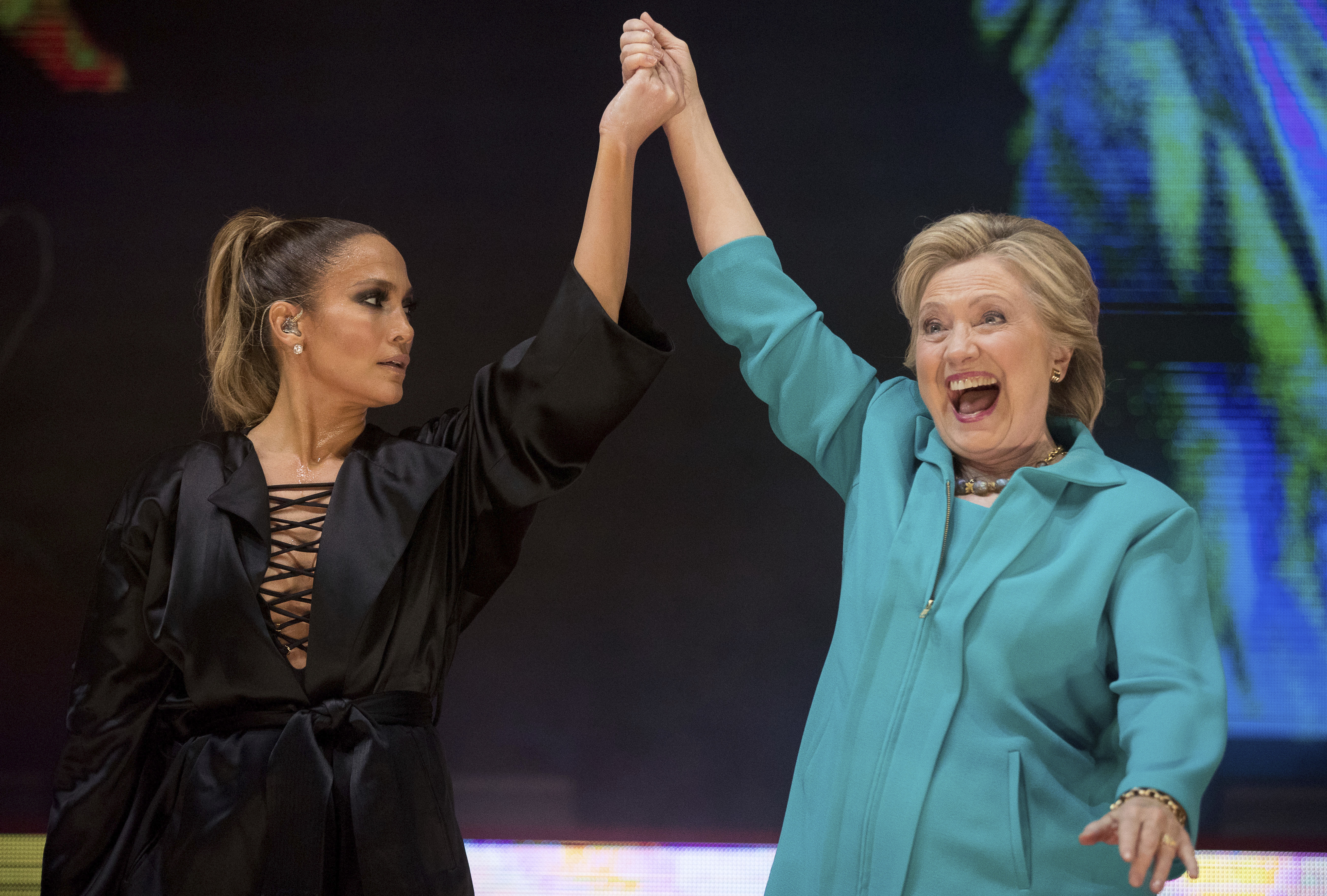Hillary Clinton takes the stage with performer Jennifer Lopez at a Get Out The Vote performance in Miami. Photo / AP