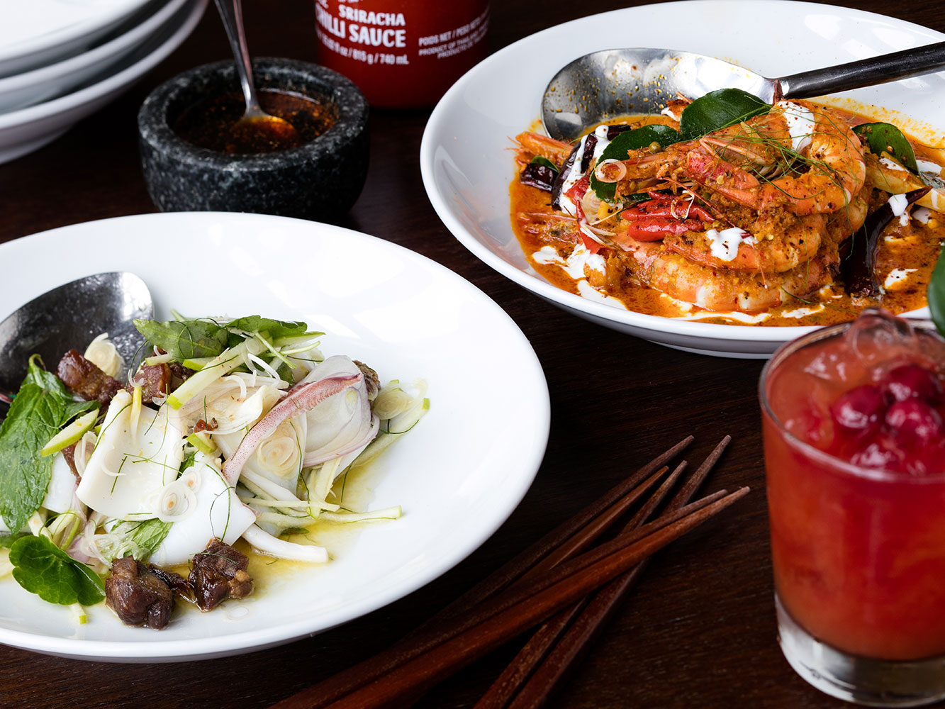 The yellow prawn curry and squid dishes from MooChowChow. Picture / Babiche Martens.
